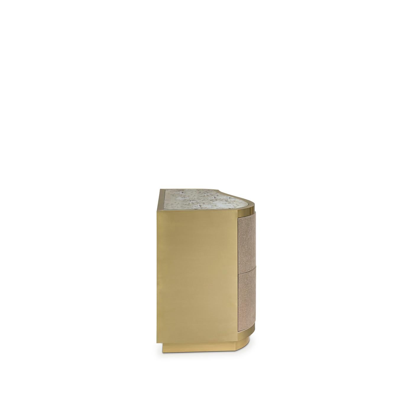 The delicate undulating front of the Poem nightstand and its leather upholstered body framed by metal bands exudes modern vintage glamour. The top of this stunning nightstand is finished with a sheet of glass to protect the leather.