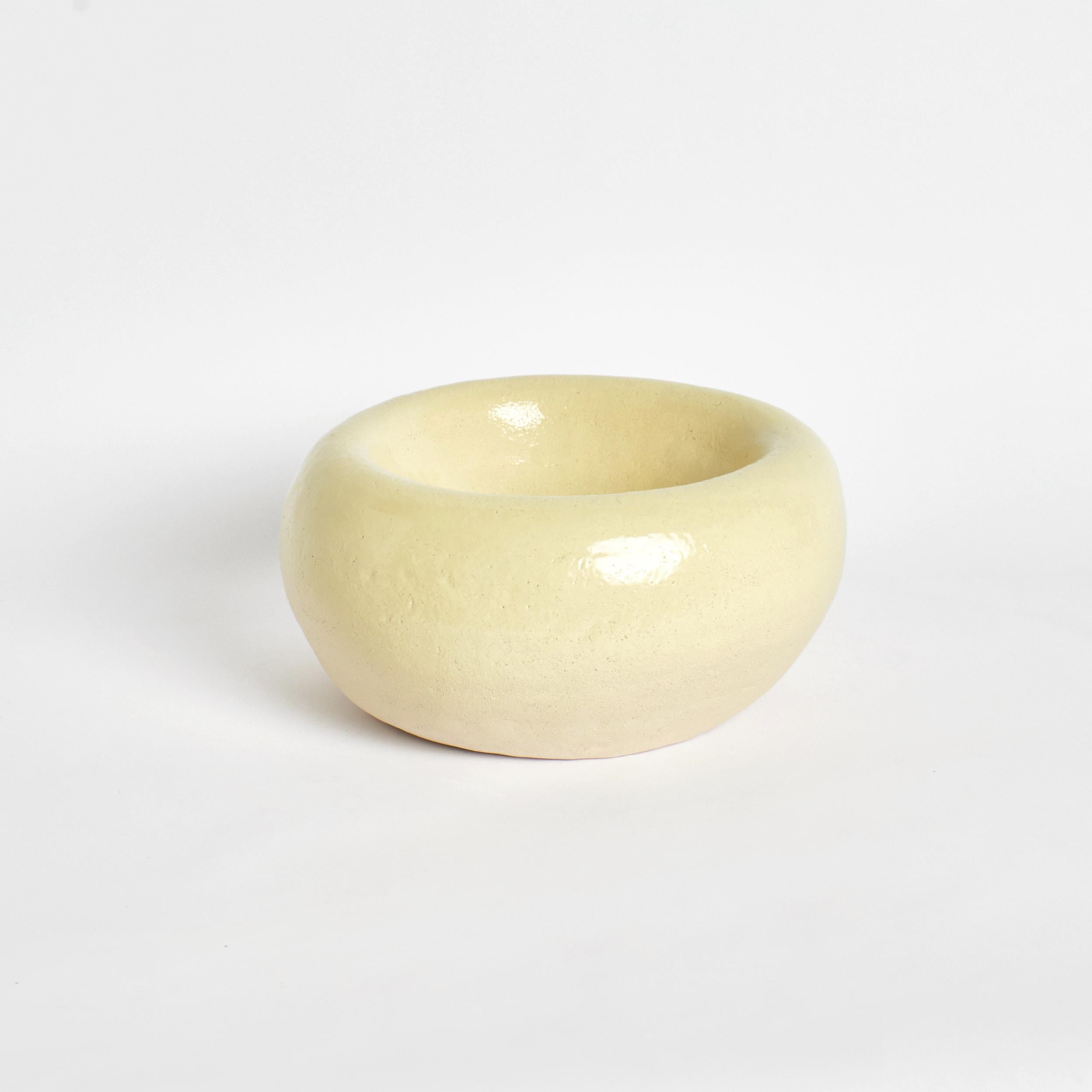 Poet bowl in yellow by Project 213A
Dimensions: D 37 x W 37 x H 17 cm
Materials: Ceramic. 

Hand-sculpted ceramic bowl with a beautiful handmade uneven shape. This extra large piece is finished with a bespoke soft yellow glaze and hallmarked