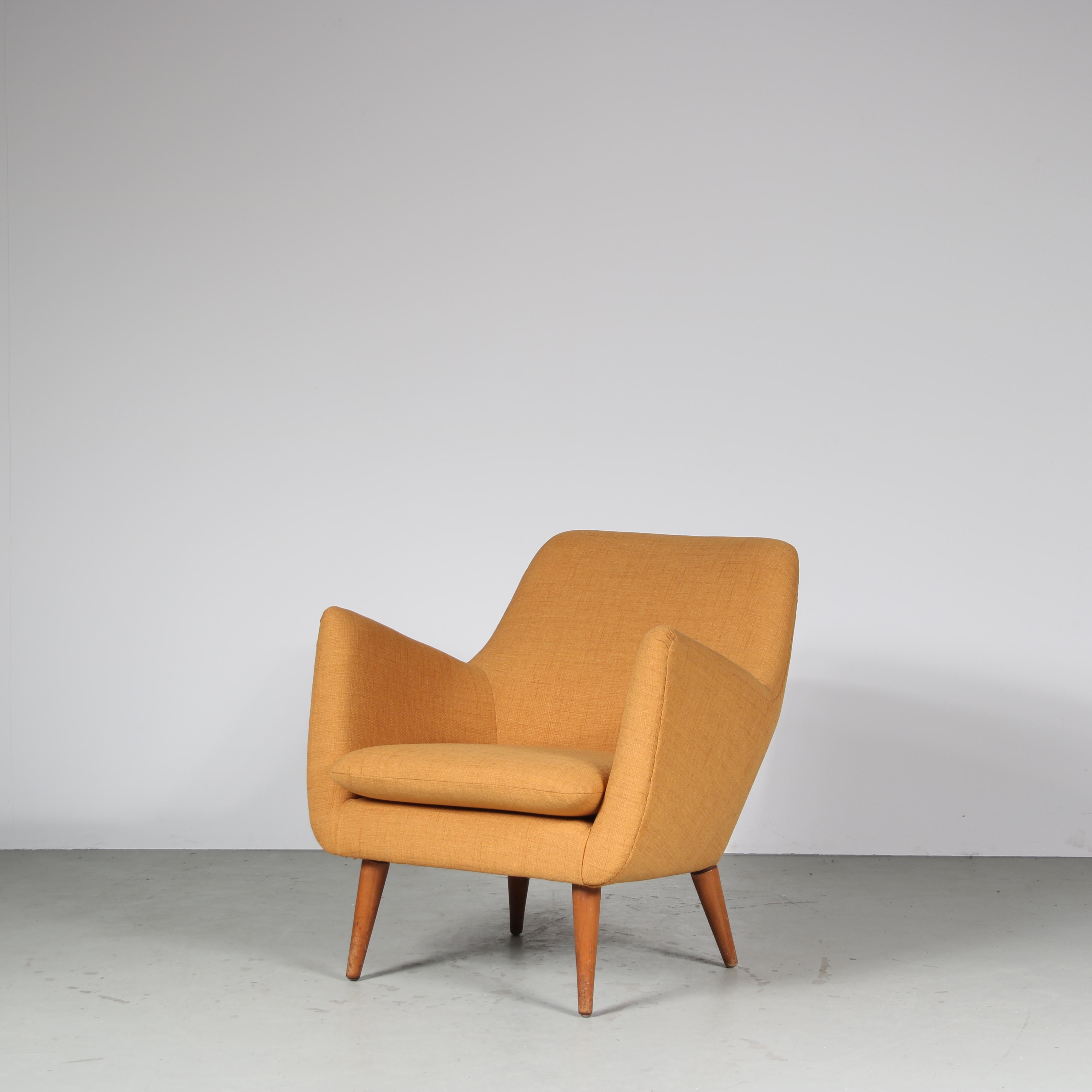 A stunning lounge chair model “Poet”, designed by Finn Juhl and manufactured by Niels Vodder in Denmark around 1950.

The chair is upholstered in high quality yellow ochre fabric, a beautiful material that creates an inviting appearance that works