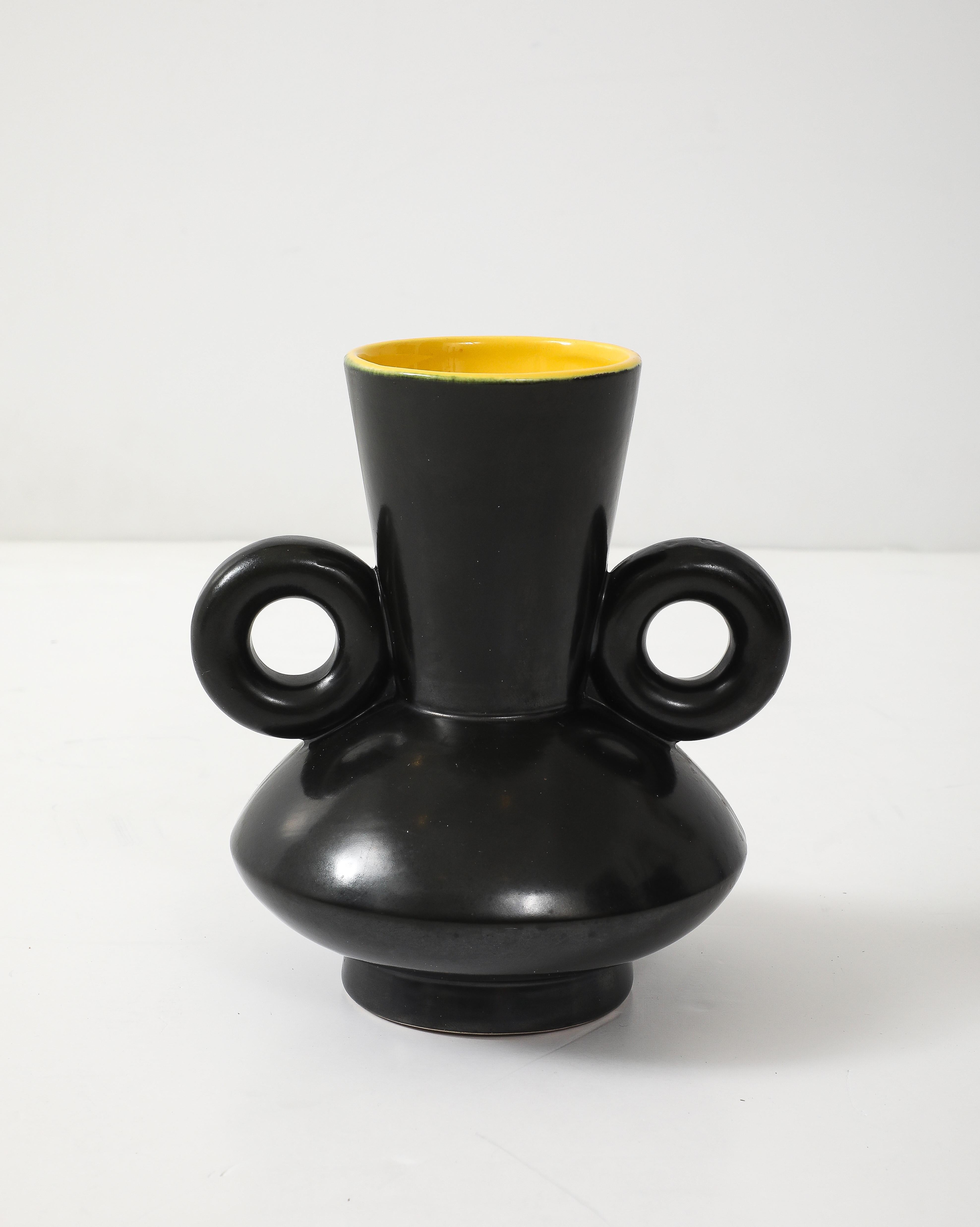 French modernist black matte glazed vessel with a contrasting yellow glaze interior. Laval Pottery.
