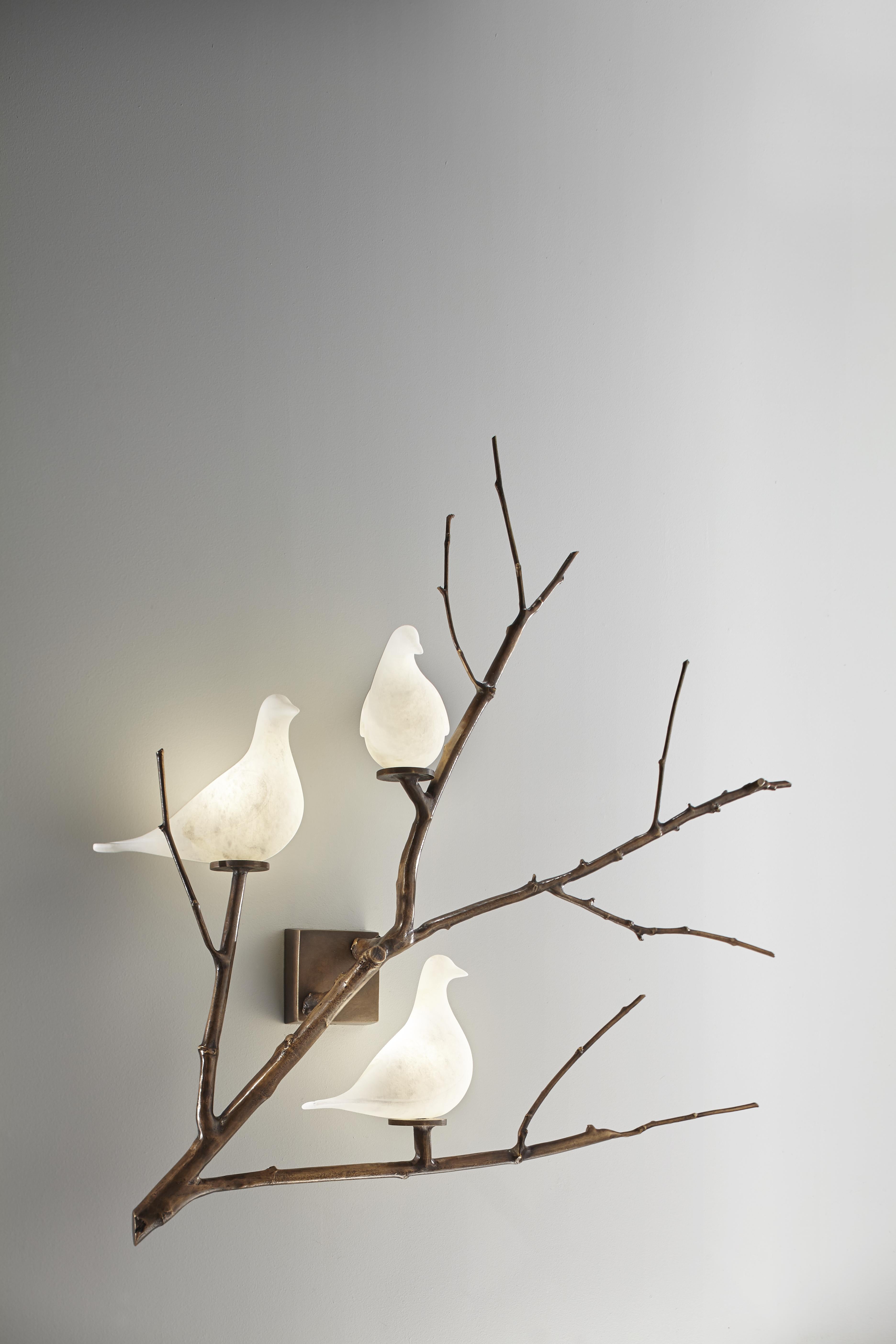 Poetic sconce with patinated bronze branches, sculpted alabaster doves, led lighting
Creation by Studio Glustin.
(Right or Left oriented model available) 

Price for 1 sconce.