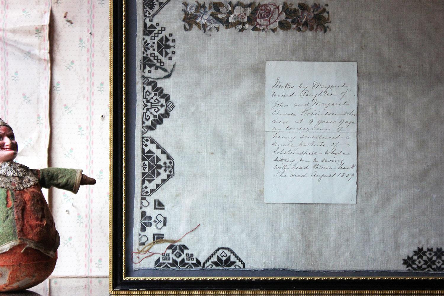 The unfinished George III period needlework sampler having a geometric medallion Quaker style border in the Ackworth school manner, enclosing two unfinished floral petit point bands; above an ink letter reading; ‘Worked by Margaret, second daughter