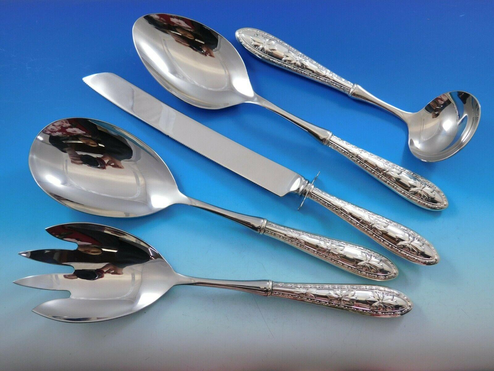 Poinsettia by Wallace 5-piece holiday serving set. The versatile serving pieces make holiday entertaining a breeze. All of these pieces have sterling silver hollow handles with stainless implements, all are original Wallace pieces. This set