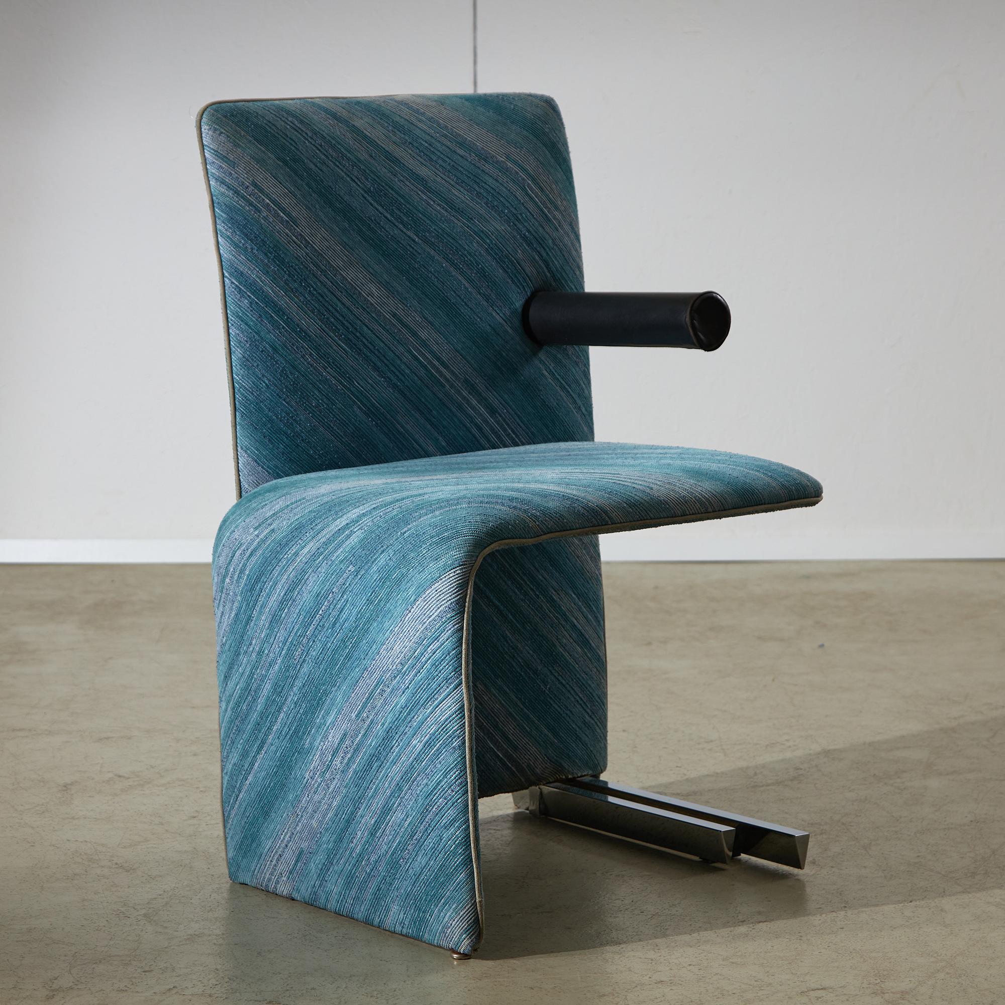 The Point Chair by Maurizio Salvato, produced in 1985 and presented at the Salone del Mobile, is an iconic piece that reflects the innovative design ethos of its time. It features a leather armrest and a distinctive metal structure that provides