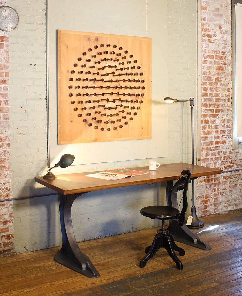 Measuring 46 in. x 46 in. x 8 in. and made entirely from reclaimed pine and mahogany spindles from a textile factory, the precise sizing and arrangement form a constellation that rewards being viewed from multiple perspectives and creates a