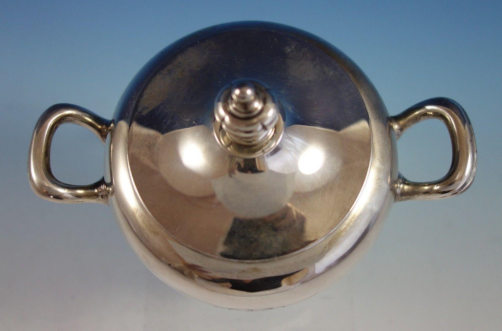 Pointed Antique by Reed & Barton / Dominick & Haff

Pointed Antique by Reed & Barton / Dominick & Haff sterling silver sugar bowl with lid marked #1103/87. The sugar bowl measures 6