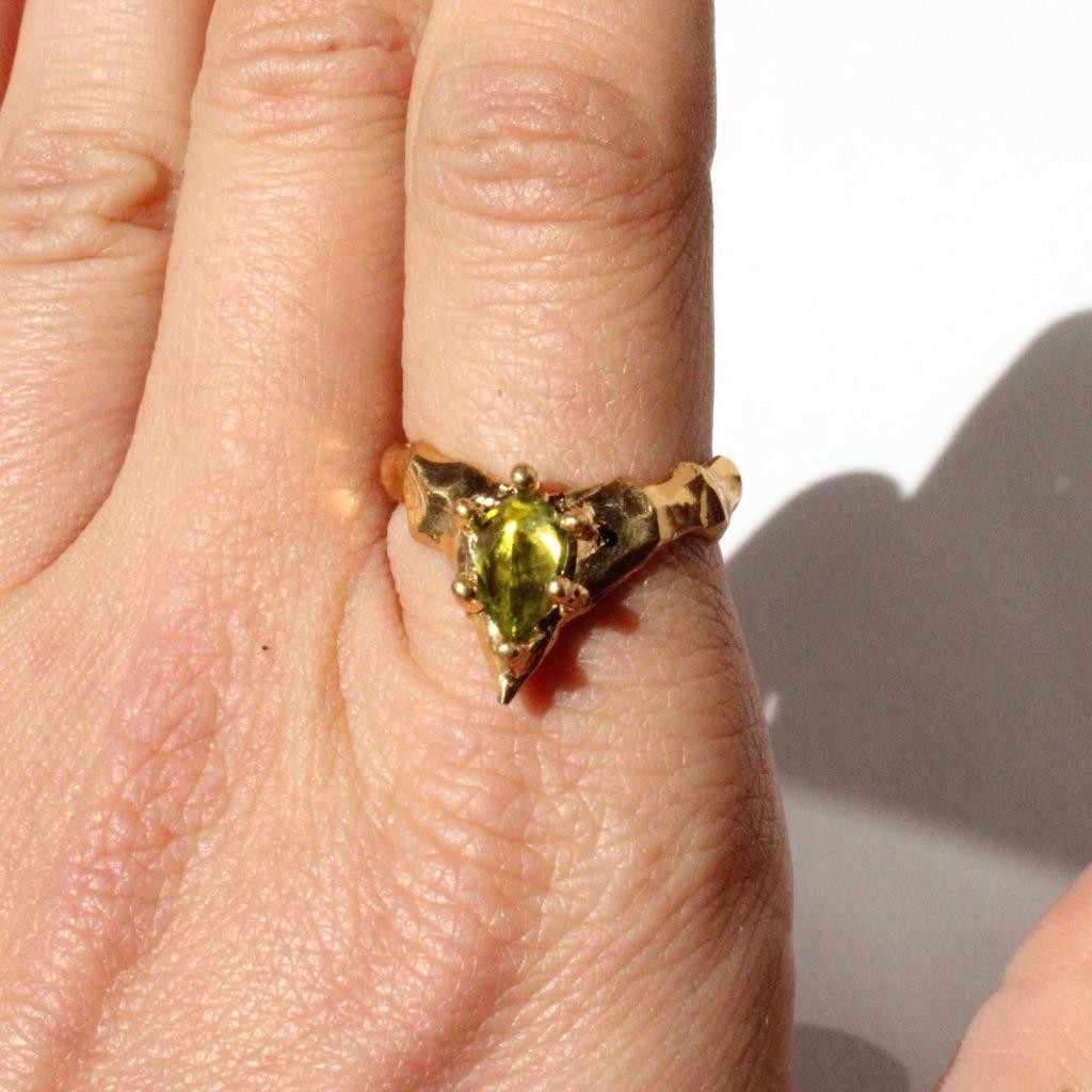 For Sale:  Pointed Hand Carved Peridot Pear Ring in 14 Karat Yellow Gold 6