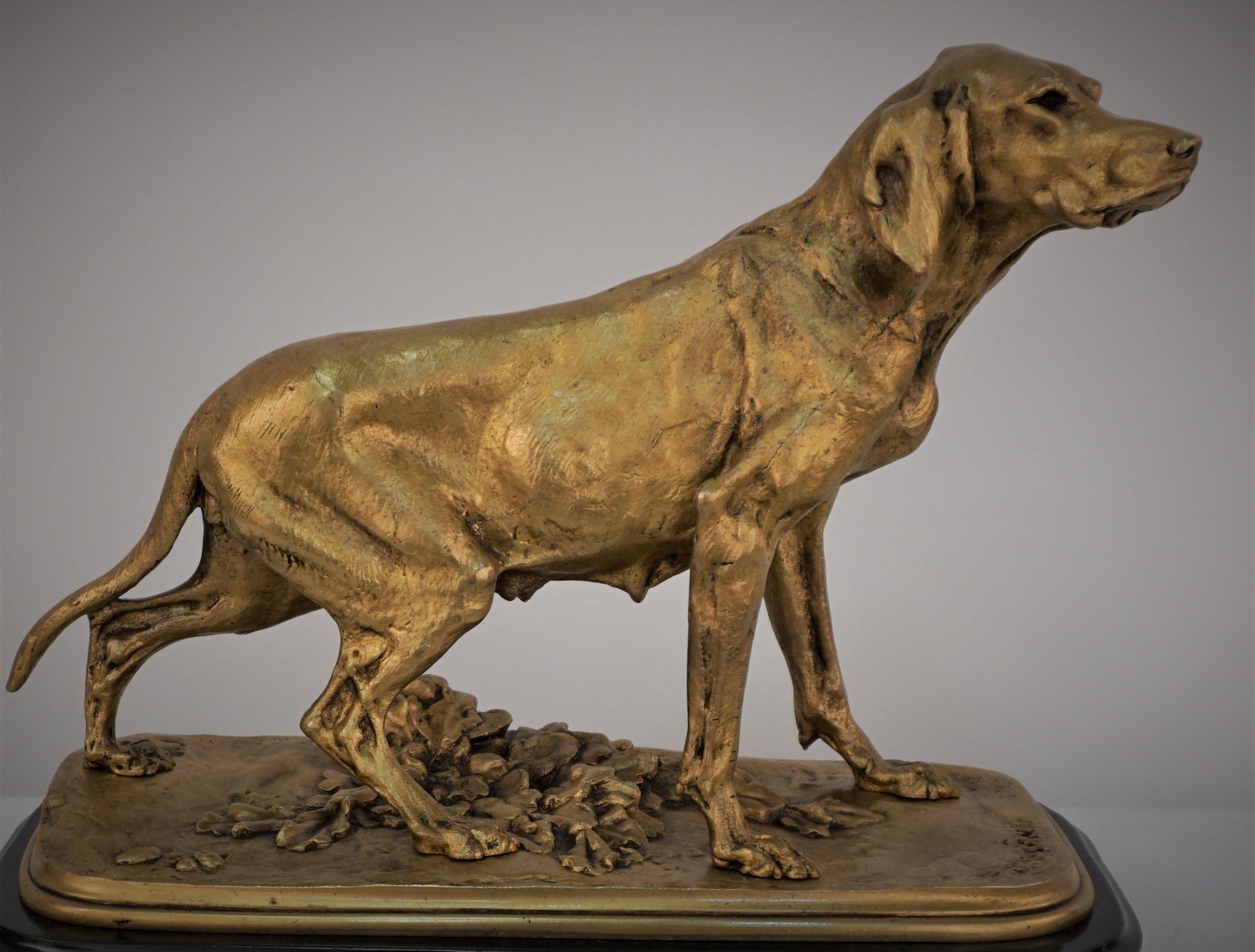 Beautiful golden bronze dog over marble base.