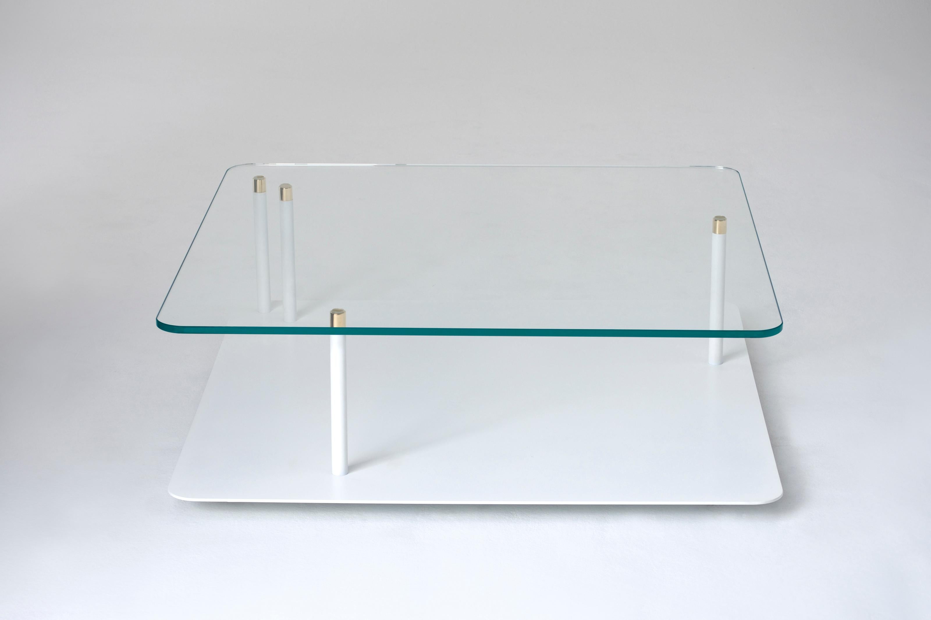 Points of Interest Square Coffee Table by Phase Design
Dimensions: D 96.5 x W 96.5 x H 29.2 cm. 
Materials: Powder-coated steel, glass and brass.

Powder coated steel base with solid brass tips and available with starphire glass top. Powder coat