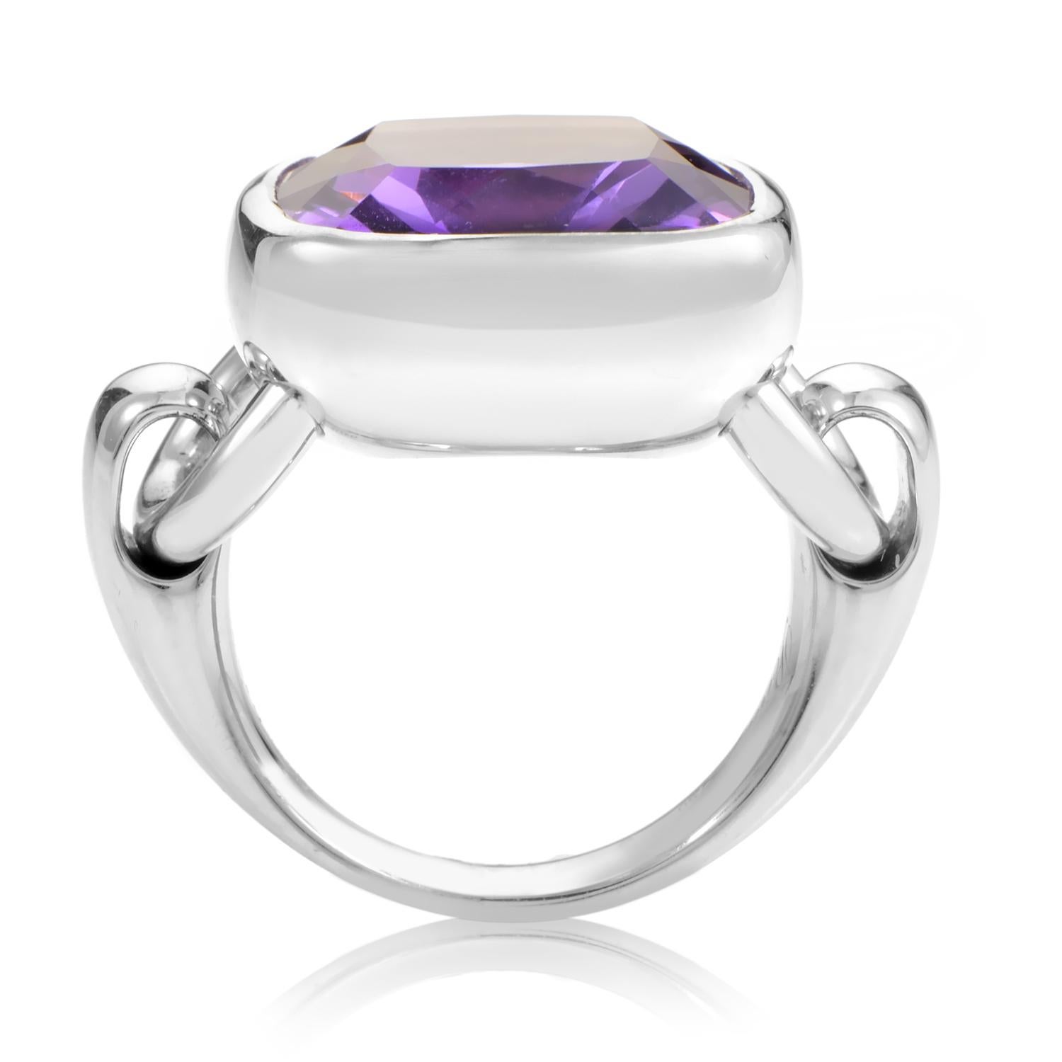 This divine Poiray ring is a pristine example of crisp class. The ring is made of 18K white gold that is specially designed with hinges for a smooth, movable, cushion shaped bezel setting. A faceted amethyst totaling ~8.35ct is beautifully