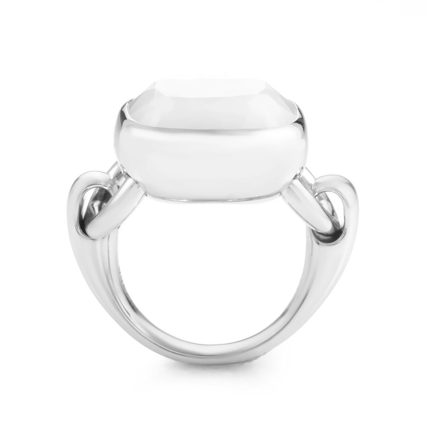 This sublime Poiray ring is delightful in its angelic charm. The ring is made of 18K white gold that is specially designed with hinges for a smooth, movable, cushion shaped bezel setting. A smooth white agate totaling ~10ct ct complements the white