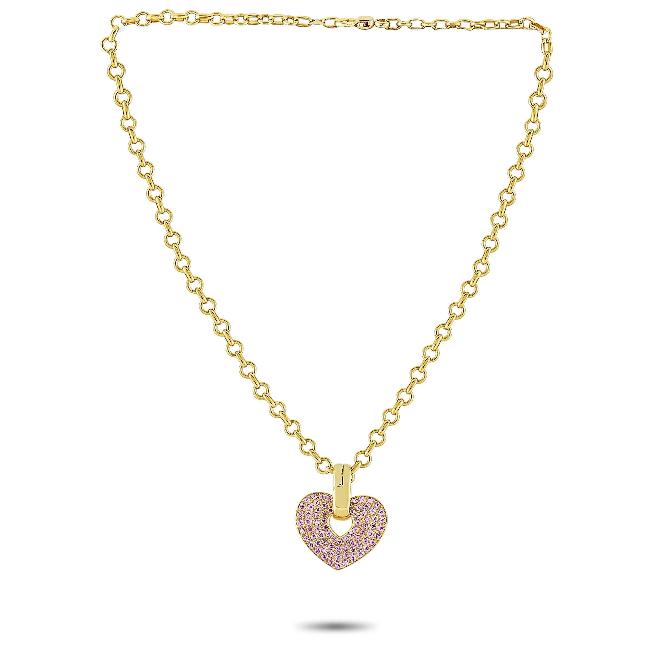 This Poiray necklace is made of 18K yellow gold and embellished with pink sapphires. The necklace weighs 40.5 grams and is presented with a 16” chain, featuring a heart pendant that measures 1.25” in length and 1.12” in width.
 
 Offered in estate