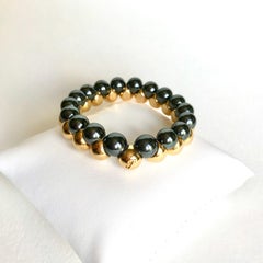 Poiray-Armband aus 18 kt Gelbgold und Hämatiten