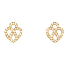 Orecchini Poiray "Coeur Entrelacé" in oro rosa e diamanti