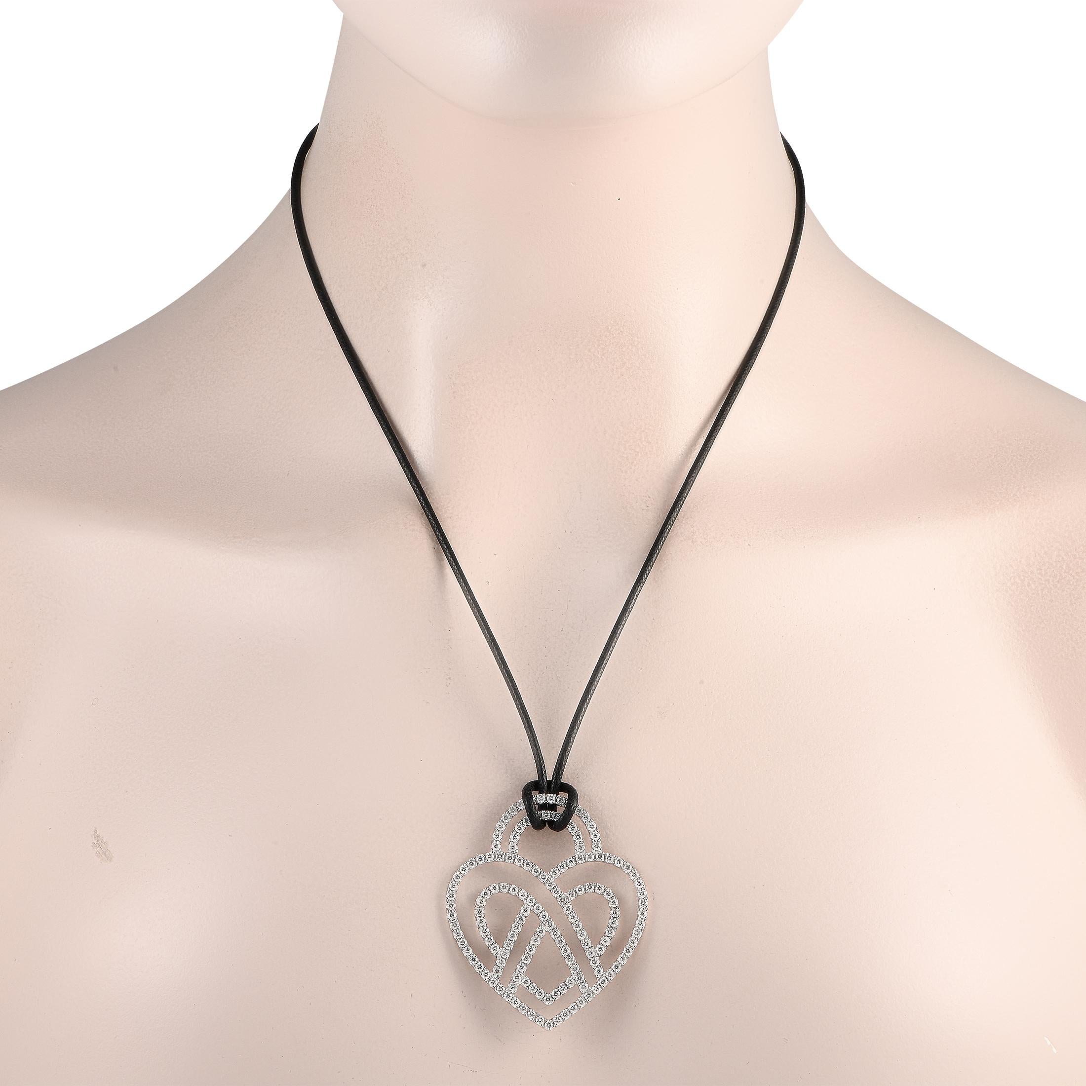 A grand display of style from Poiray, this large pendant will steal your heart. The heart motif is shaped in 18K White Gold to mesmerizing effect. Its precious contours ripple with the luxurious sparkle of 3.75ct diamonds. A truly magnificent design.