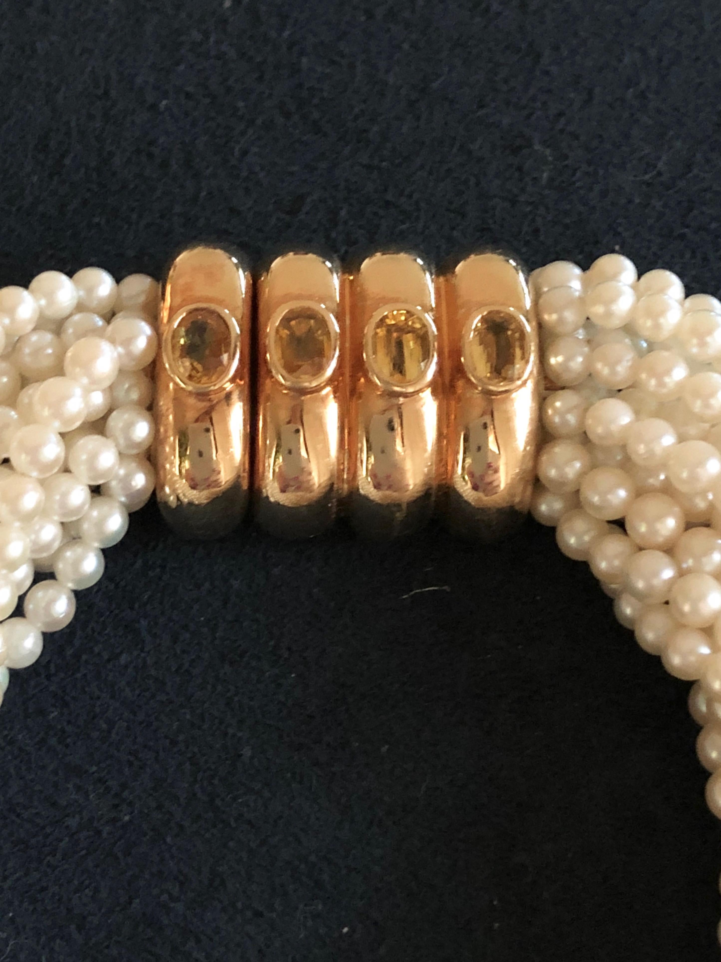 Elegant and sophisticated torsade bracelet made of 14 strands of Akoya pearls. 
Features a 18K gold 4-bands clasp with Poiray maker's mark. 
Lenght: 21.5 cm
Condition: Very Good
Comes With: Original Poiray pouch 

All items at la Bourse du Luxe are