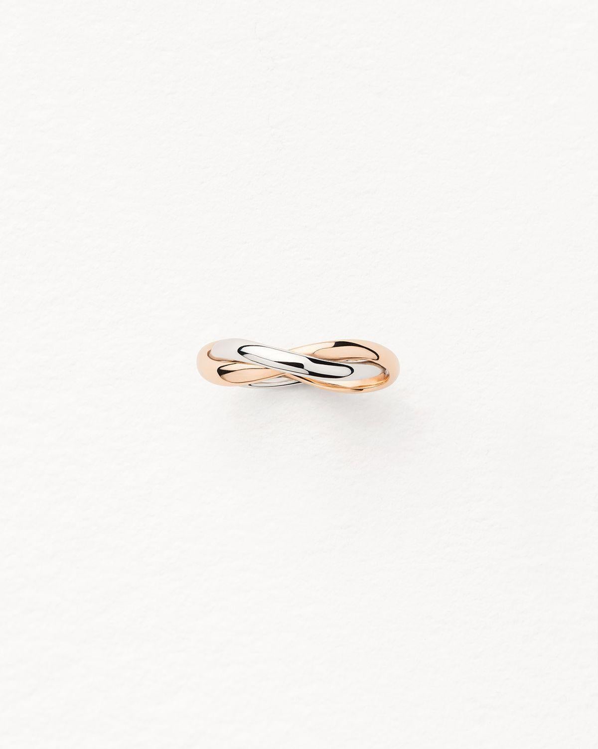 Der Ring Tresse de Poiray aus Rot- und Weißgold ist ein Schmuckstück von großer Finesse und bemerkenswerter Eleganz. Diese Kreation ist eine Hommage an die Schmuckkompetenz des Hauses Poiray, das für die Qualität seiner Kreationen bekannt ist. Das