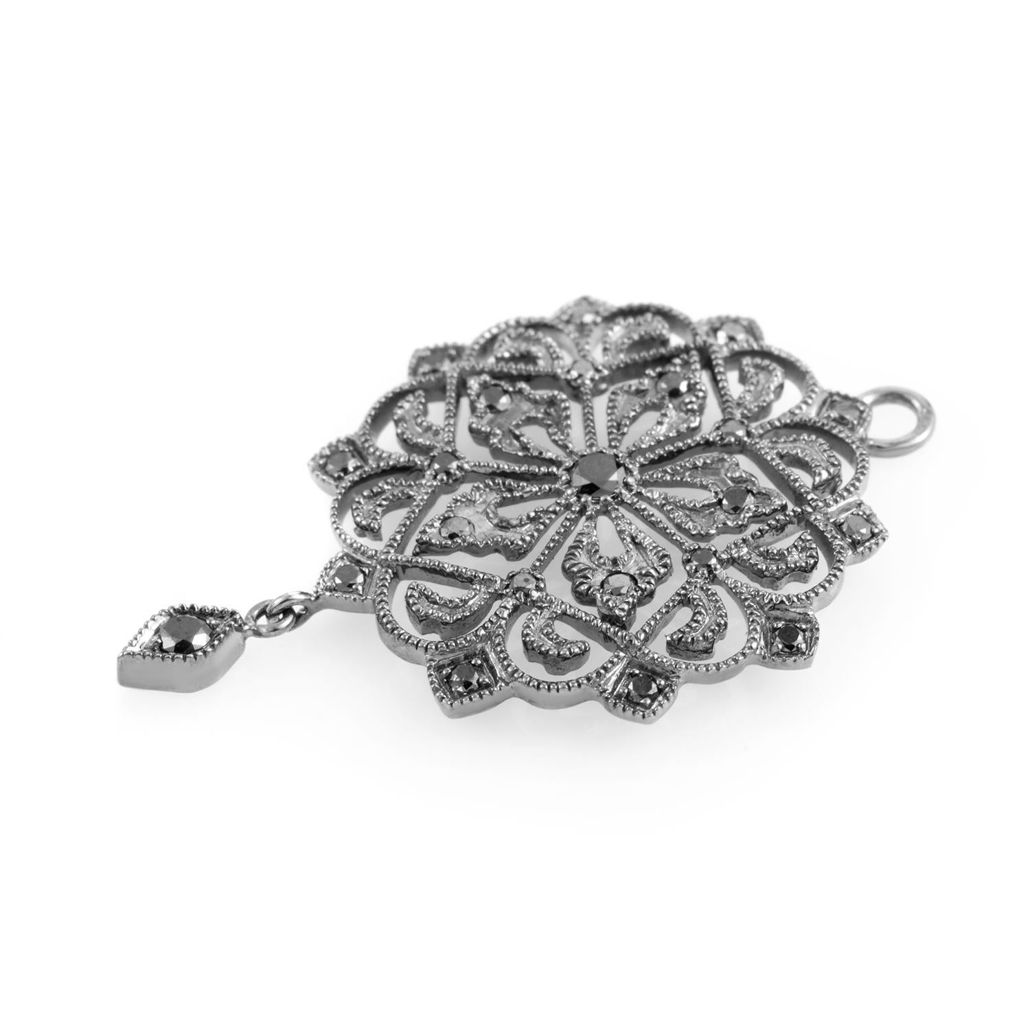 Dazzling in its sophisticated complexity and spellbinding in its magnificent artistic spirit, this exquisite pendant from Poiray assumes a stylized form of a flower, made of black rhodium-plated 18K white gold and adorned with stunning black
