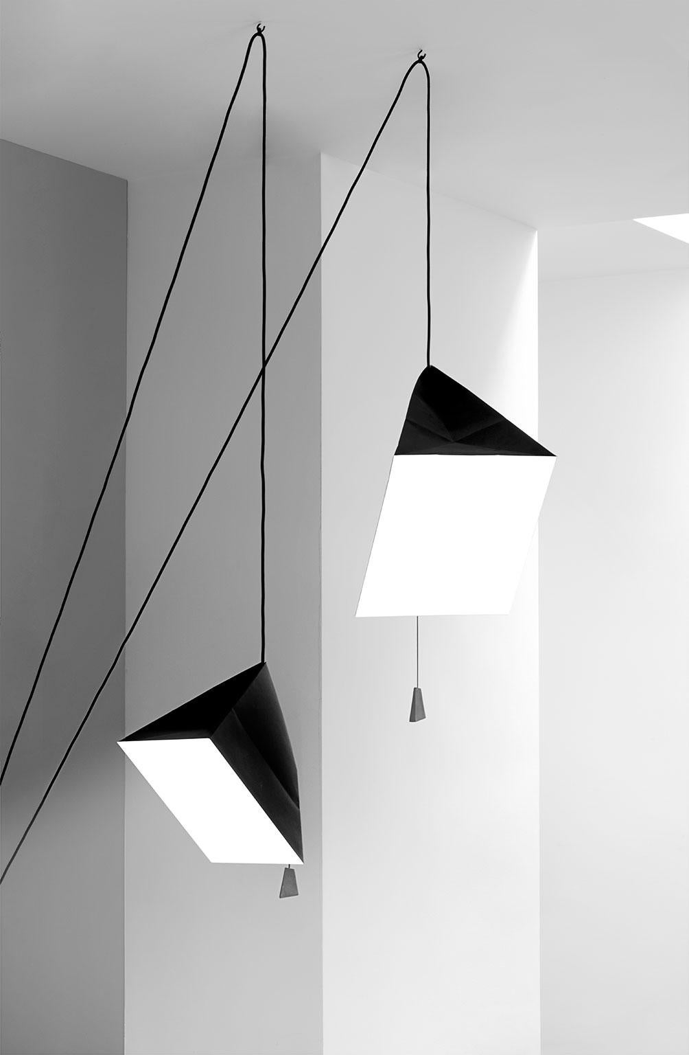 Pairing a strong shape with a fragile material, Poise is a clean, modern origami.
The pendant comes with a 6m (19,7’) long cable freeing up creative possibilites for installation. The graphic lines of the cable going up and down in the space