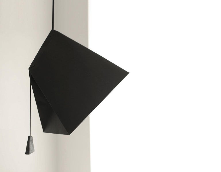 Pairing a strong shape with a fragile material, Poise is a clean, modern origami.
The triple installation comes with one small and two large pendants together with a white lacquered wooden ceiling fixing.

As with the Akari Series from the 1950s,