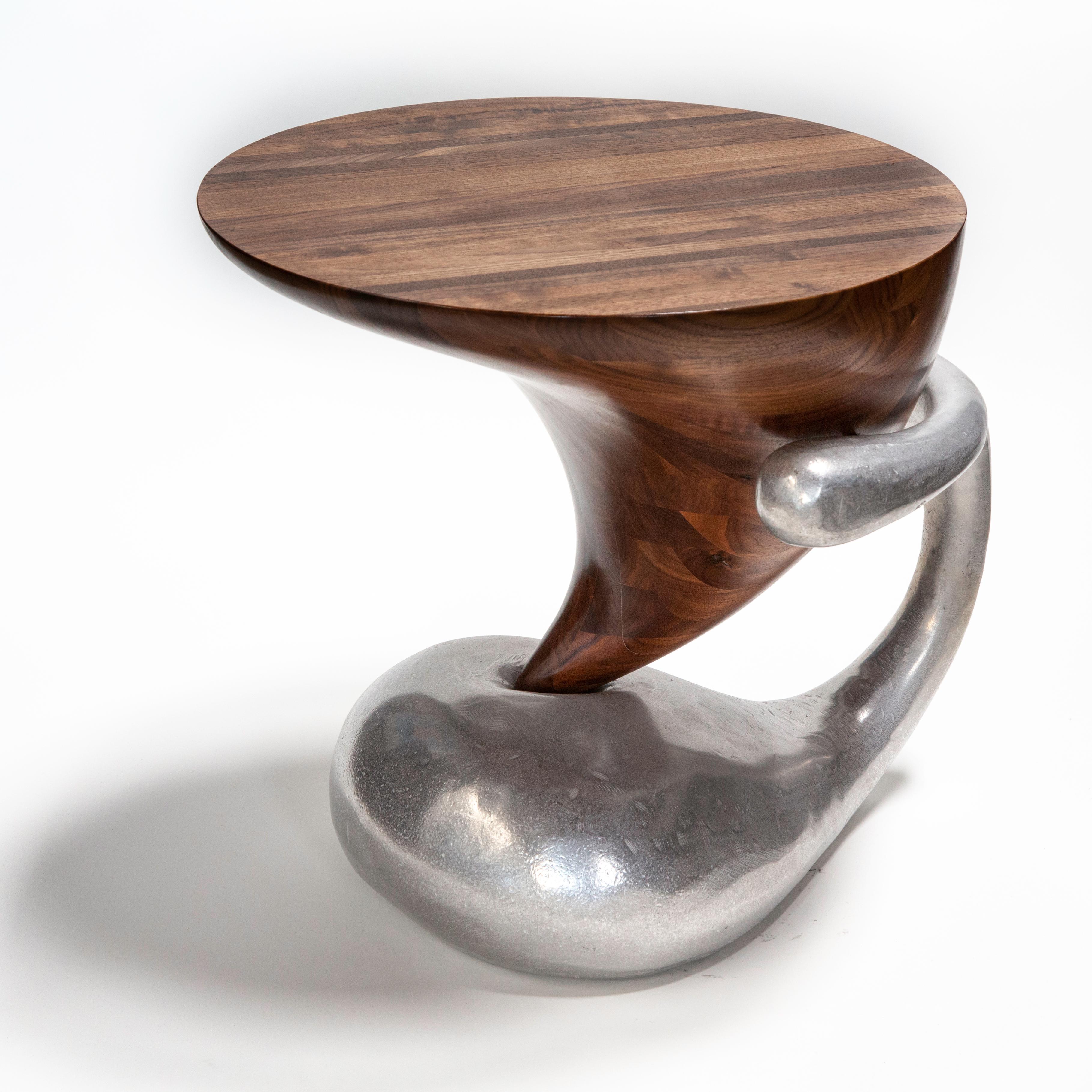 Jordan Mozer (b.1958), paradise poke side table, cast and burnished recycled aluminium and solid Wisconsin walnut, Chicago, USA, 2018.
Provenance: collection of the artist. Etched signature.
Measurements: 20” x 24” x 21” ( 51 cm l x 61 cm x 53 cm