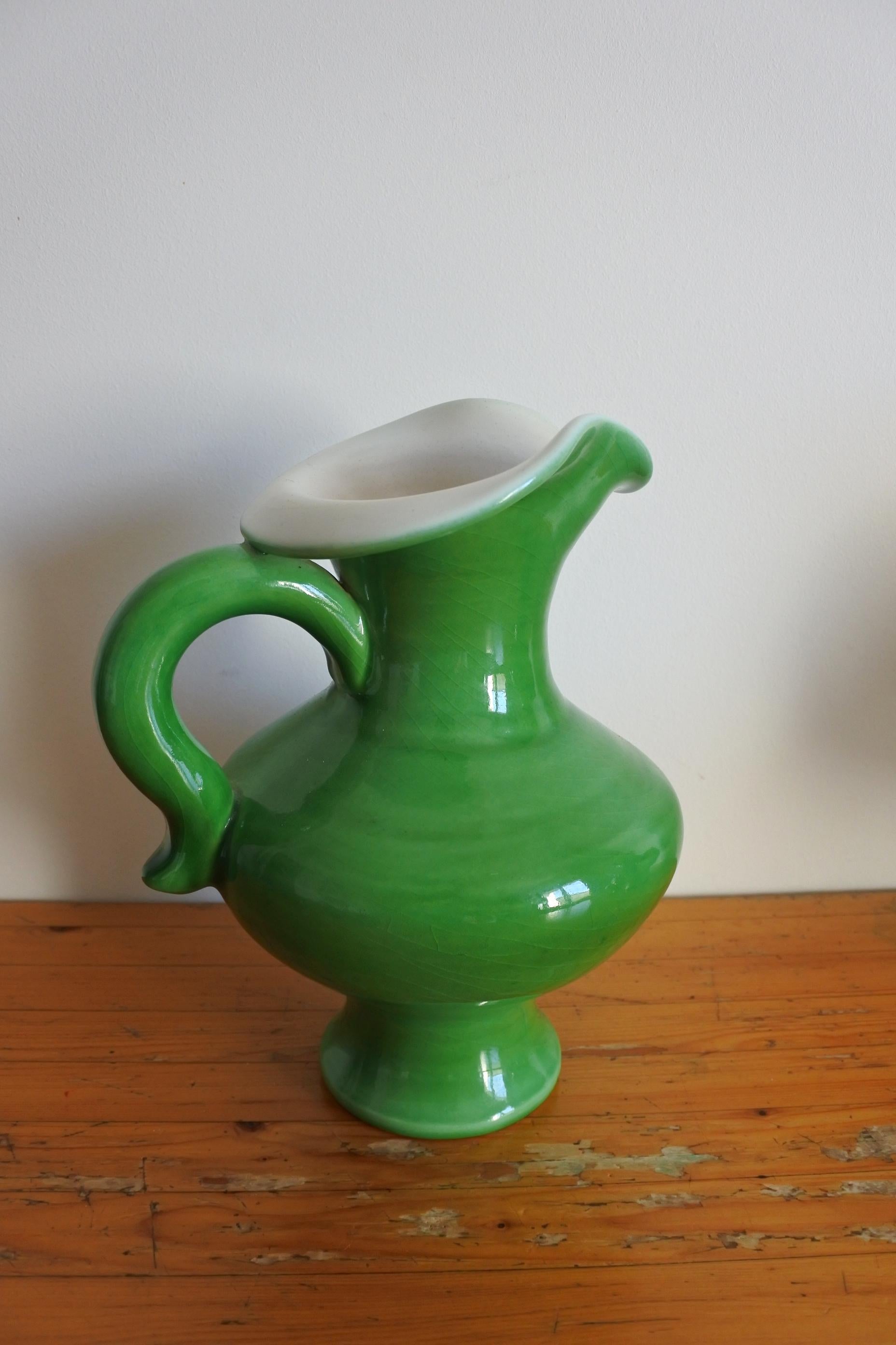 Freeform ceramic pitcher vase by French potter Pol Chambost..
Green and white glaze.
Signed.