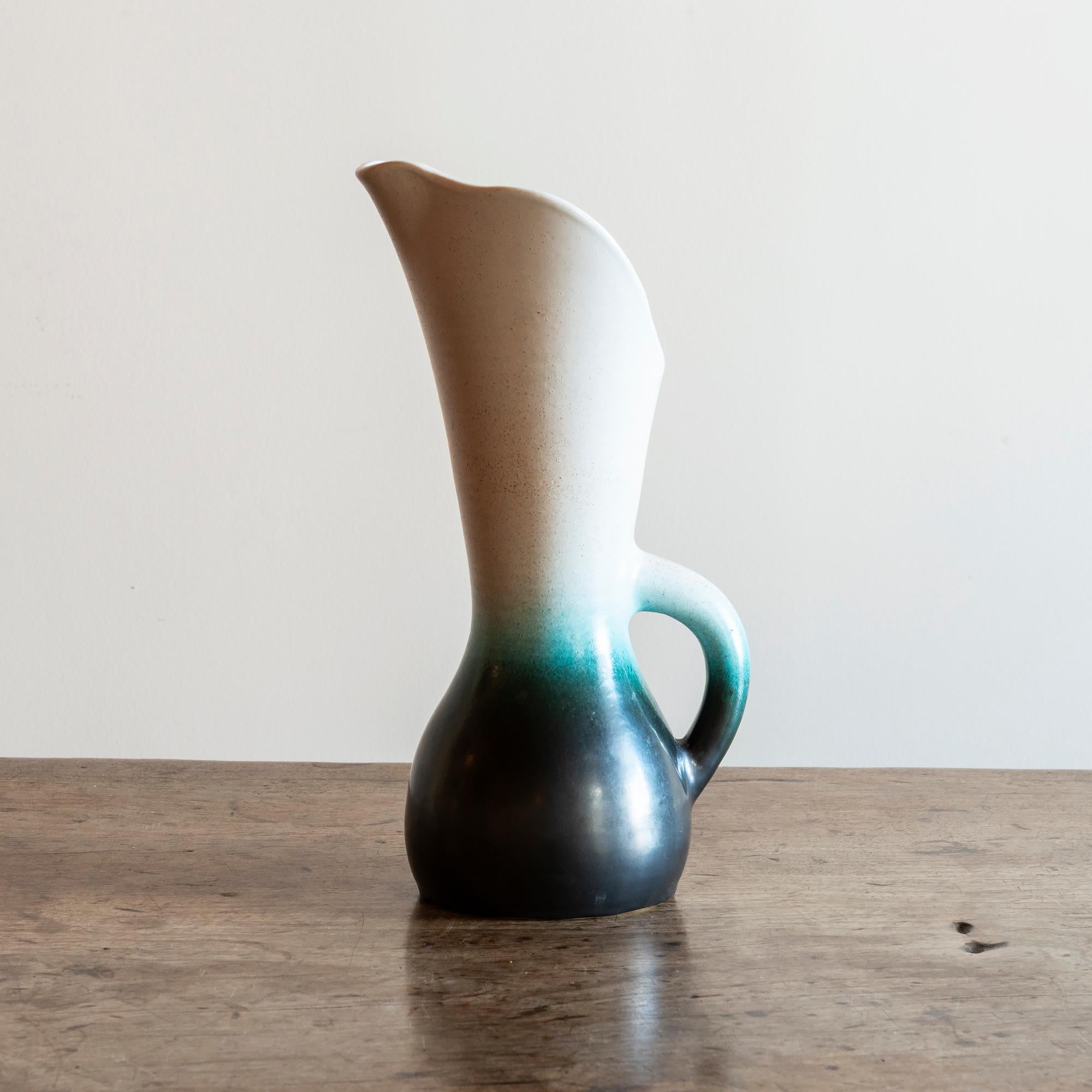 Pol Chambost glazed earthenware vessel with an elegant flared spout, in cream and gradations of aqua to black. Underside incised Poterie Pol Chambost 899, France, 1950s.
  