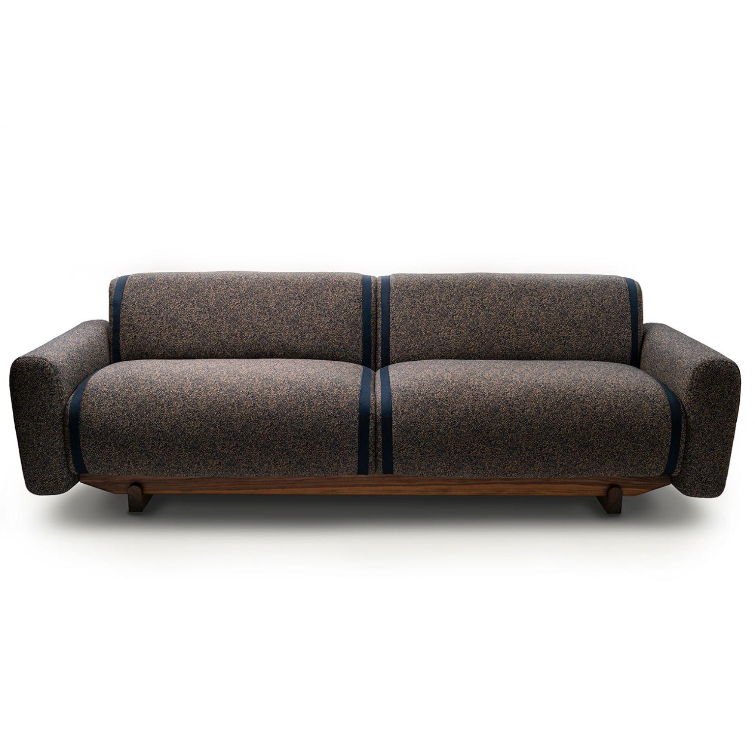 3 seats pola sofa by Sebastian Herkner
Materials: Upholstery: Fabric or leather
 Structure: Stained wood, Noce Canaletto solid wood
Dimensions: W247.5 x D92.5 x H75.5 cm




The massive wood base of the Pola sofa is a nod to Sebastian