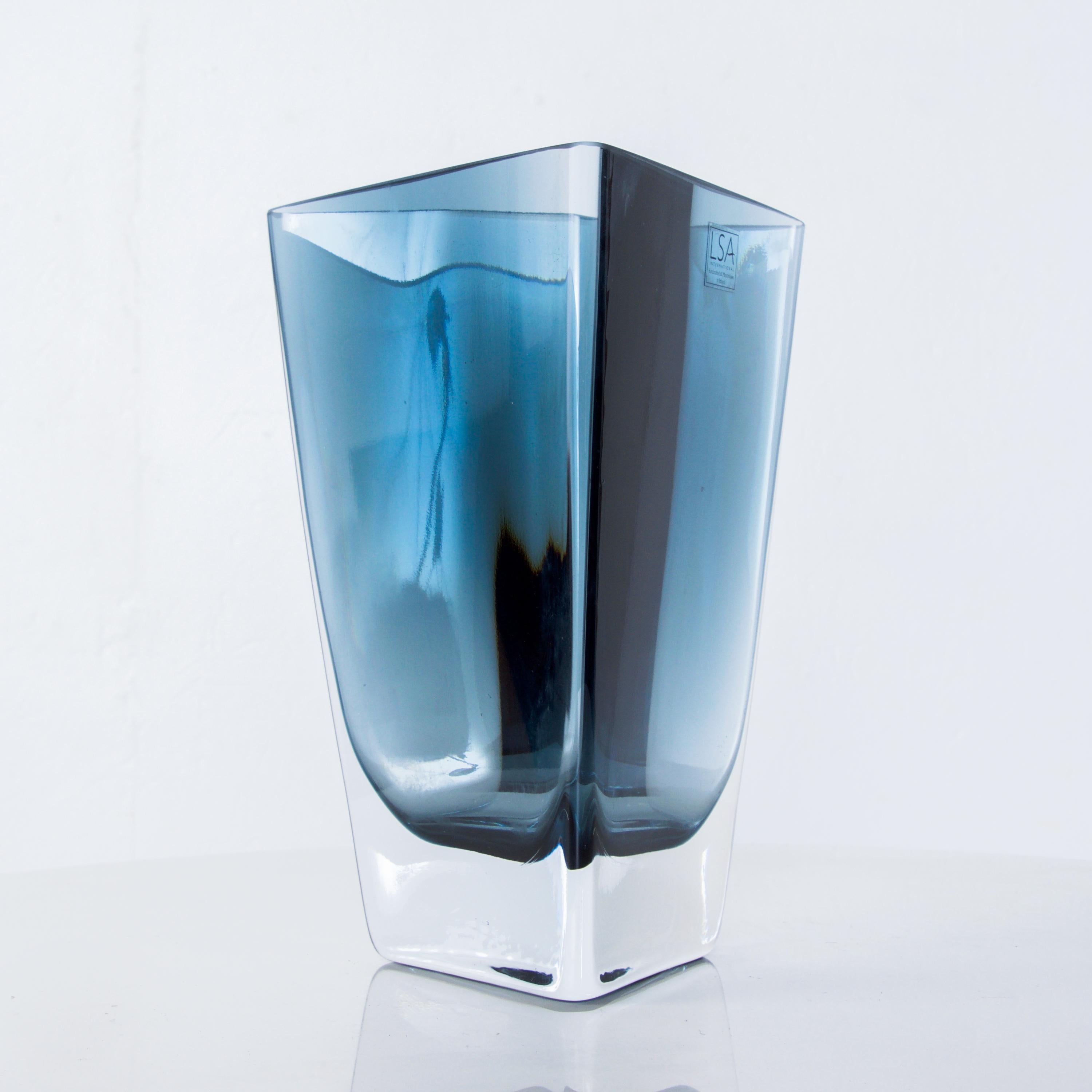 For your consideration, a triangular handblown decorative glass vase.
Made in Poland. Retains original label from the maker. 
Dominant color is blue and transparent. 
Dimensions: 8 1/2
