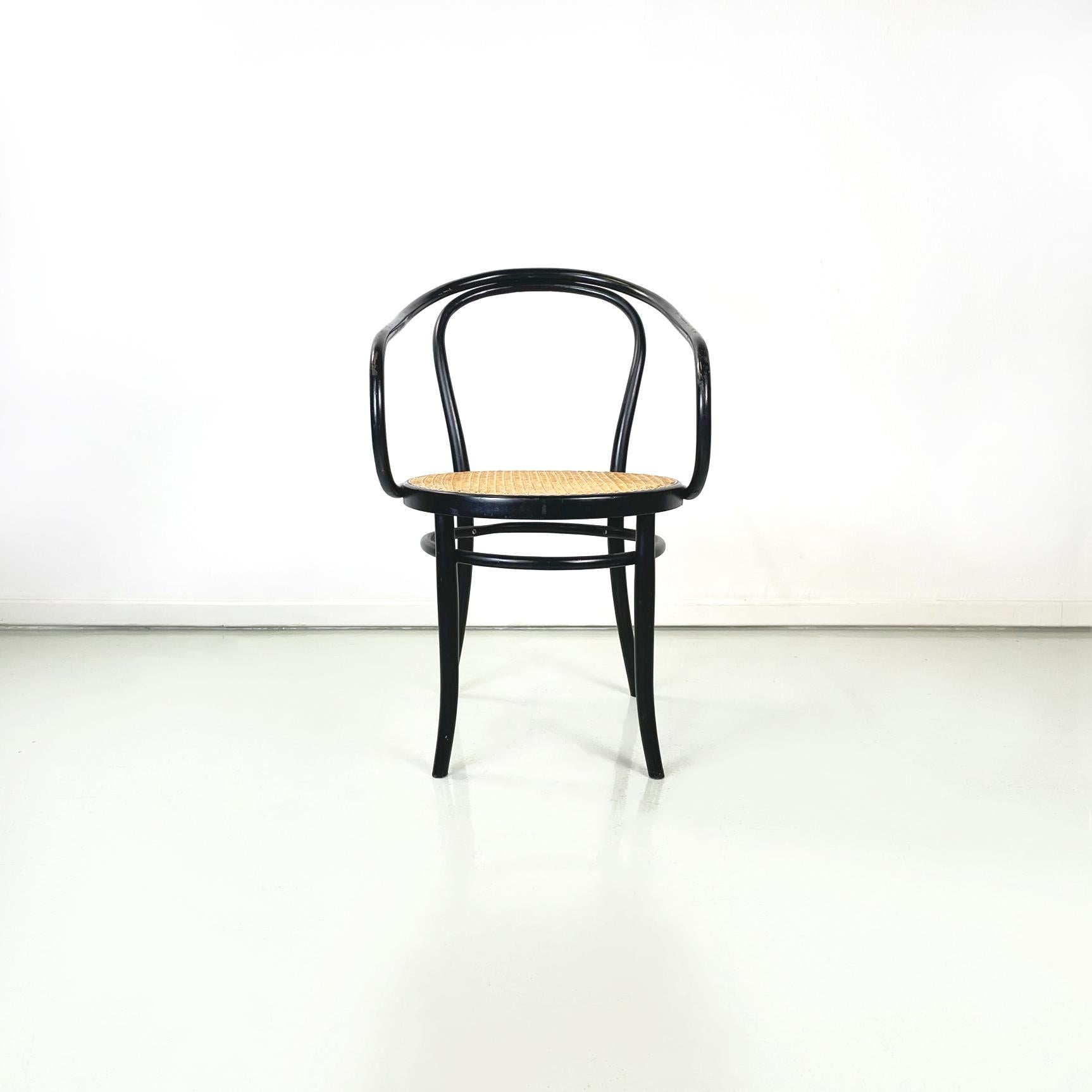 Poland midcentury Wooden and Straw Chair Thonet by ZPM Radomsko, 1960s
Chair in Thonet style with round Vienna straw seat. The structure, which includes backrest and legs, is in curved wood with a round section and painted black.
Produced by ZPM