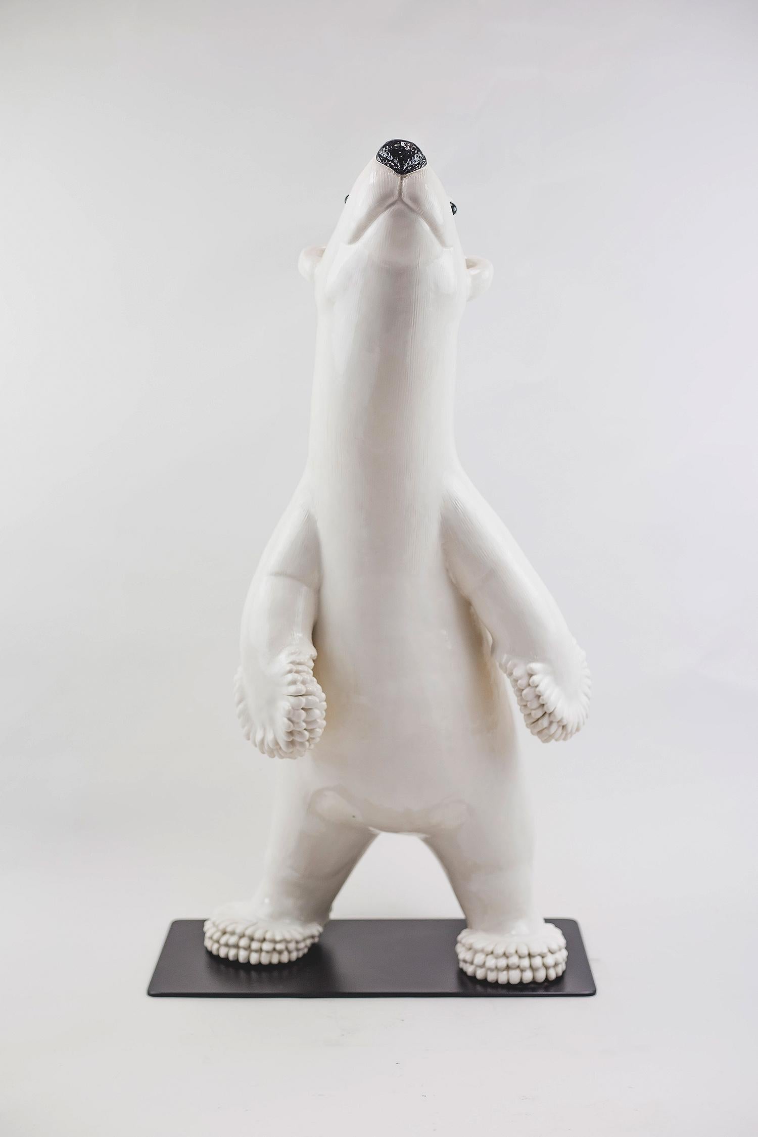 Sculpture representing a polar bear in glazed eartheware.
French work realized by the French artist Valerie Courtet, trained by Jacques Pieffer, Meilleur Ouvrier de France, in the Saint Jean l'Aigle de Longwy Manufactory.