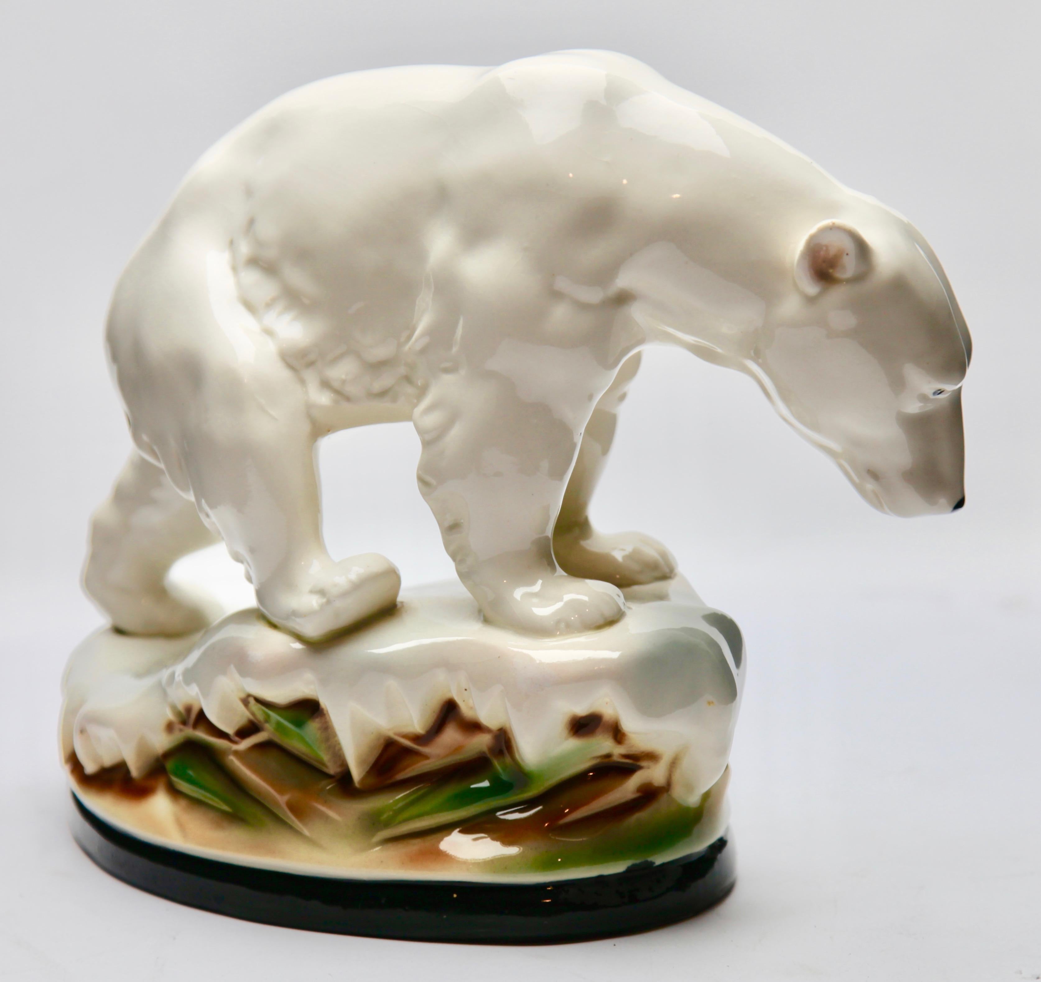Naturalistic figurine in white glazed porcelain. Finely detailed and modeled hand painted figurine of a polar bear on an icy outcrop. 
Attributed to various German factories but correct identity is unclear. No maker's mark, but impressed number on