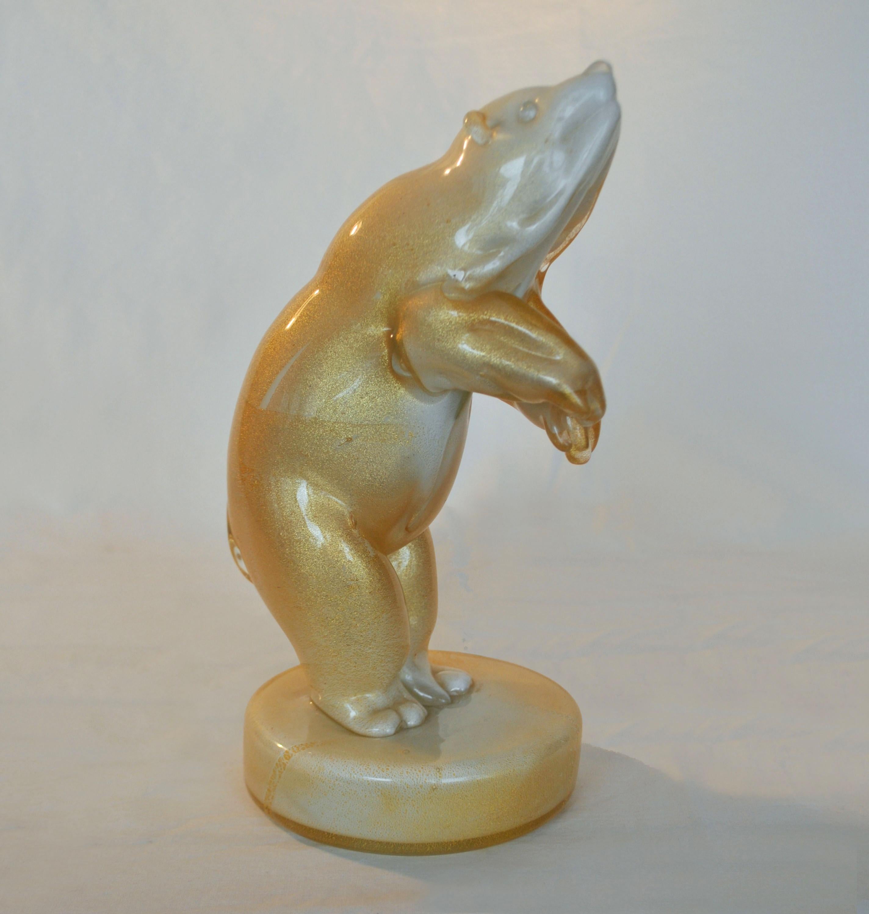 Polar bear sculpture in lattimo glass with applied gold leaf, Sommerso, Seguso, Murano 1930s Italy.

Measures: Height 9 1/2 inches
Width 4 1/2
Depth 5 7/16 inch.

   
