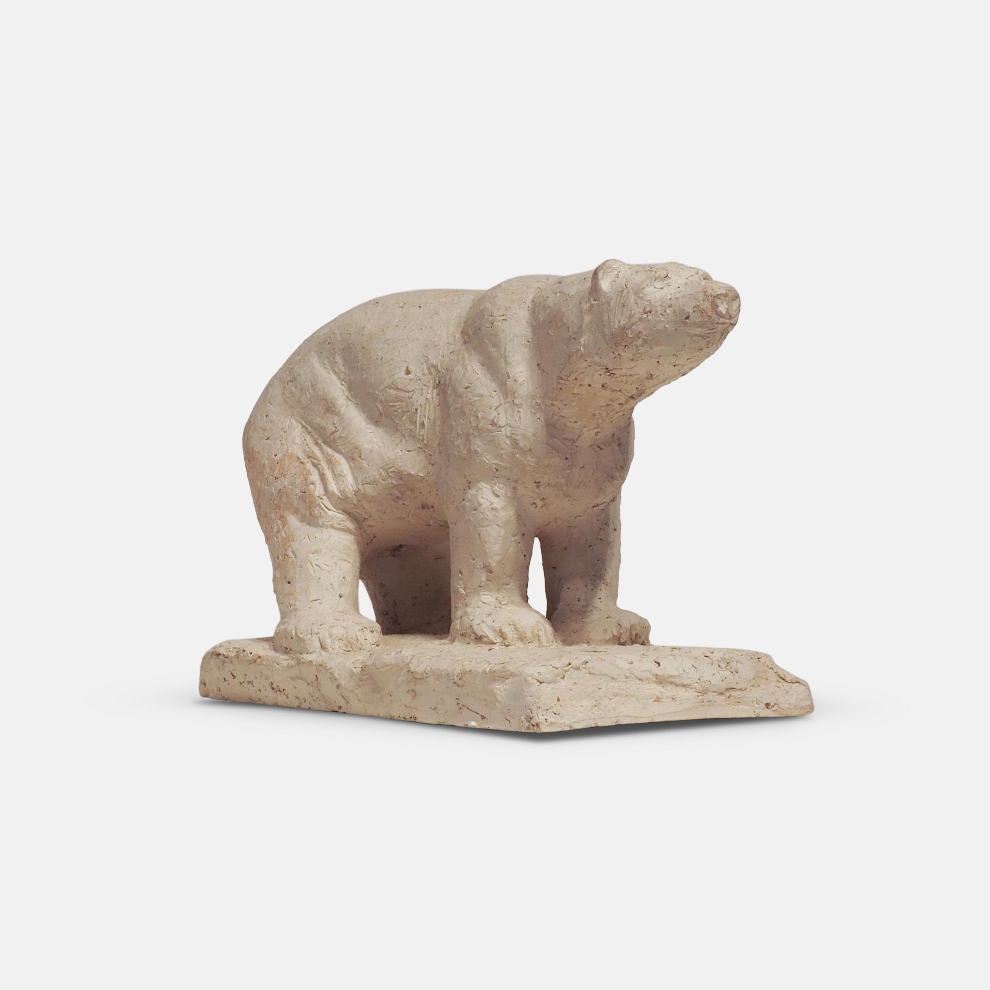 A modernist sculpture in of a Polar Bear by the Belgian artist Herbert Geldhof (1929-2007) . 
Born in Africa Geldhof returned to Belgium in the 1950s where he specialised in animal subjects.
Cast in plaster of Paris, signed to base H. Geldhof.