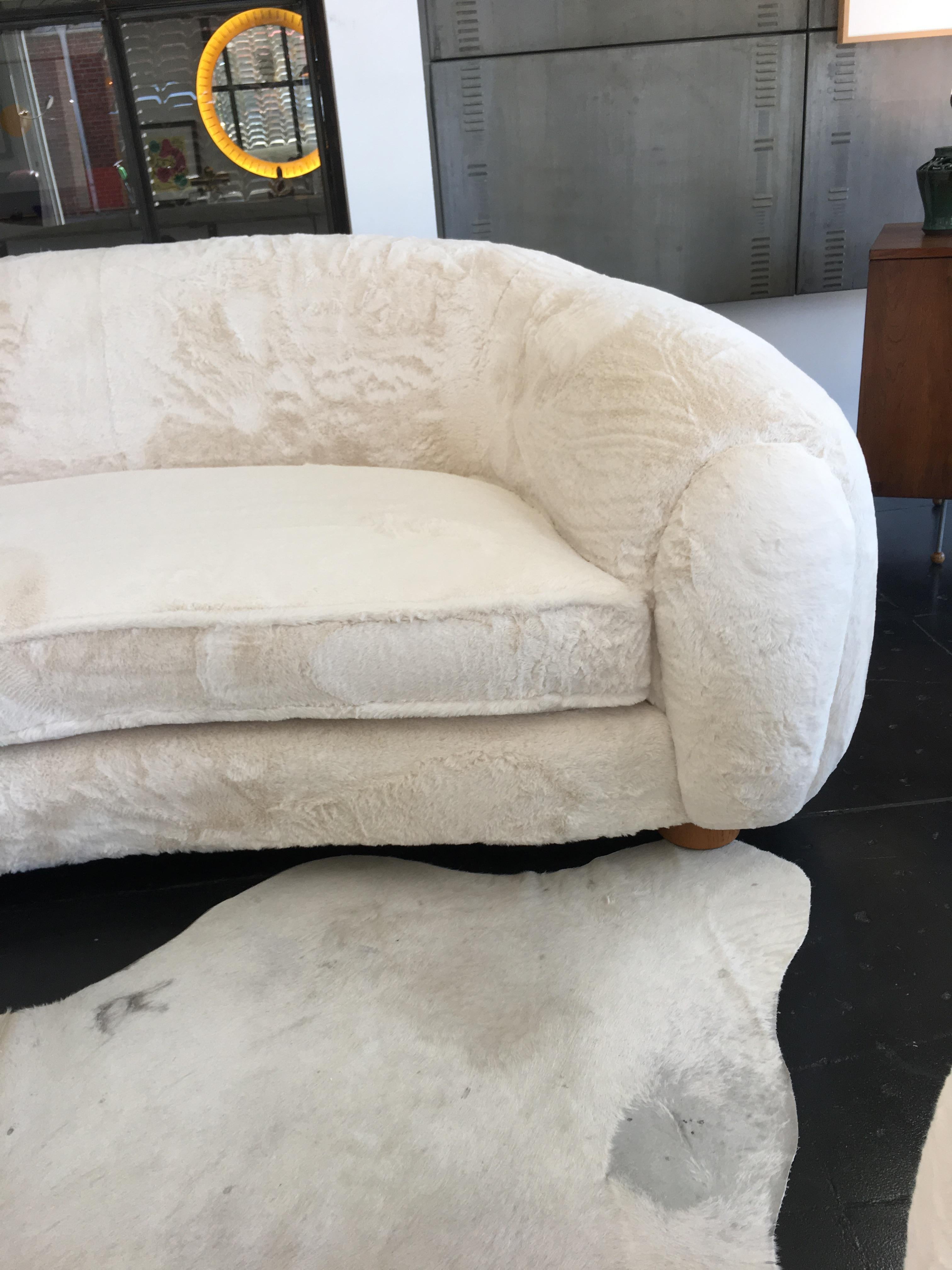 Beautiful polar bear sofa, 1950s. Recently upholstered with off-white shearling fabric. The sofa was not in good condition, therefore we have included pictures showing the before and after.