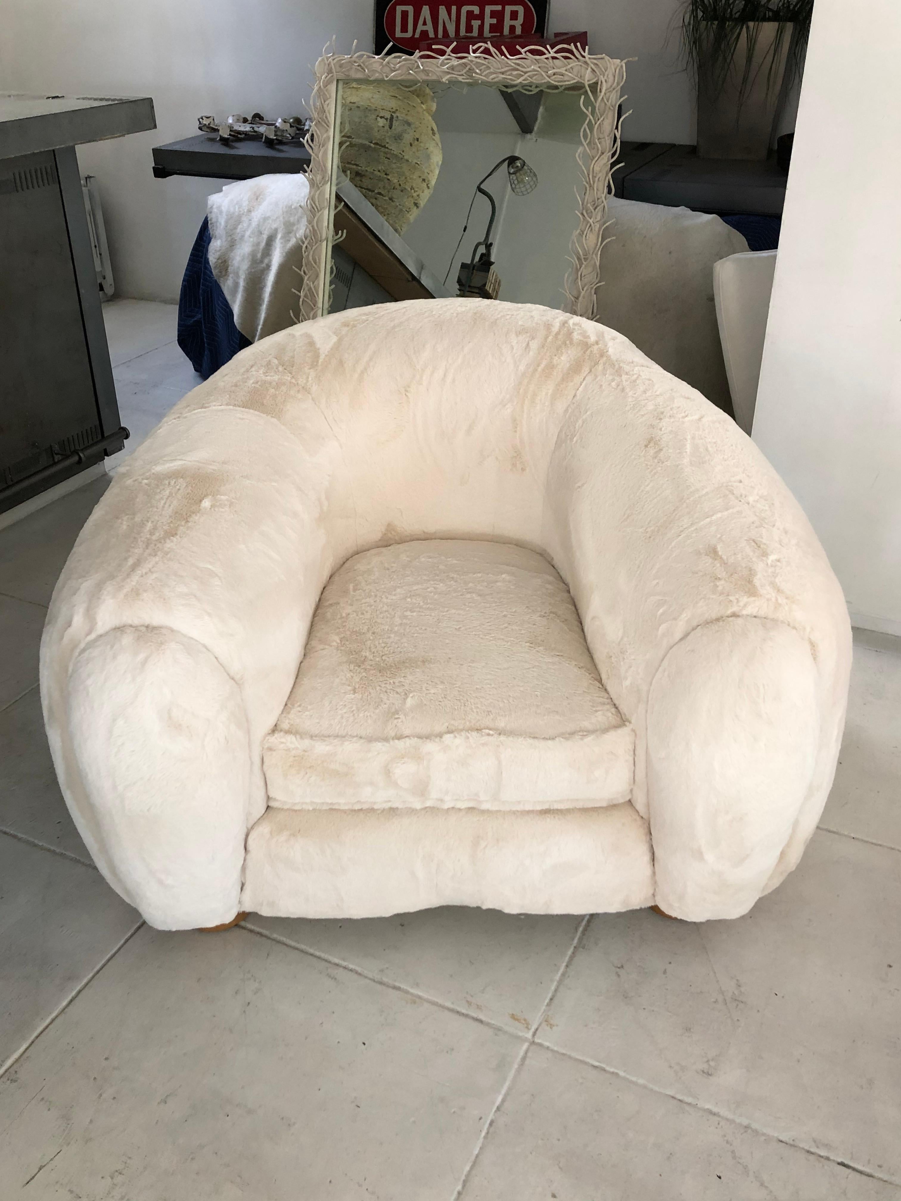 Exceptional 1950s chair after Jean Royere, recently upholstered with off-white shearling fabric.
Provenance: Purchased in France from a closed-down hotel.