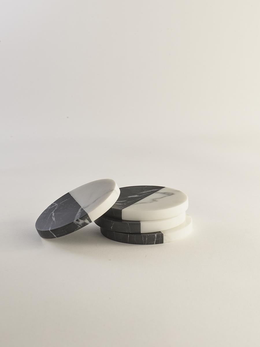 The Polar Coasters juxtapose the vibrant beauty of Nero Marble with our Bianco Marble in an elegant set of four, each piece honed by hand and finished with a black non-slip base.

Greg Natale’s latest range of luxury home accessories presents