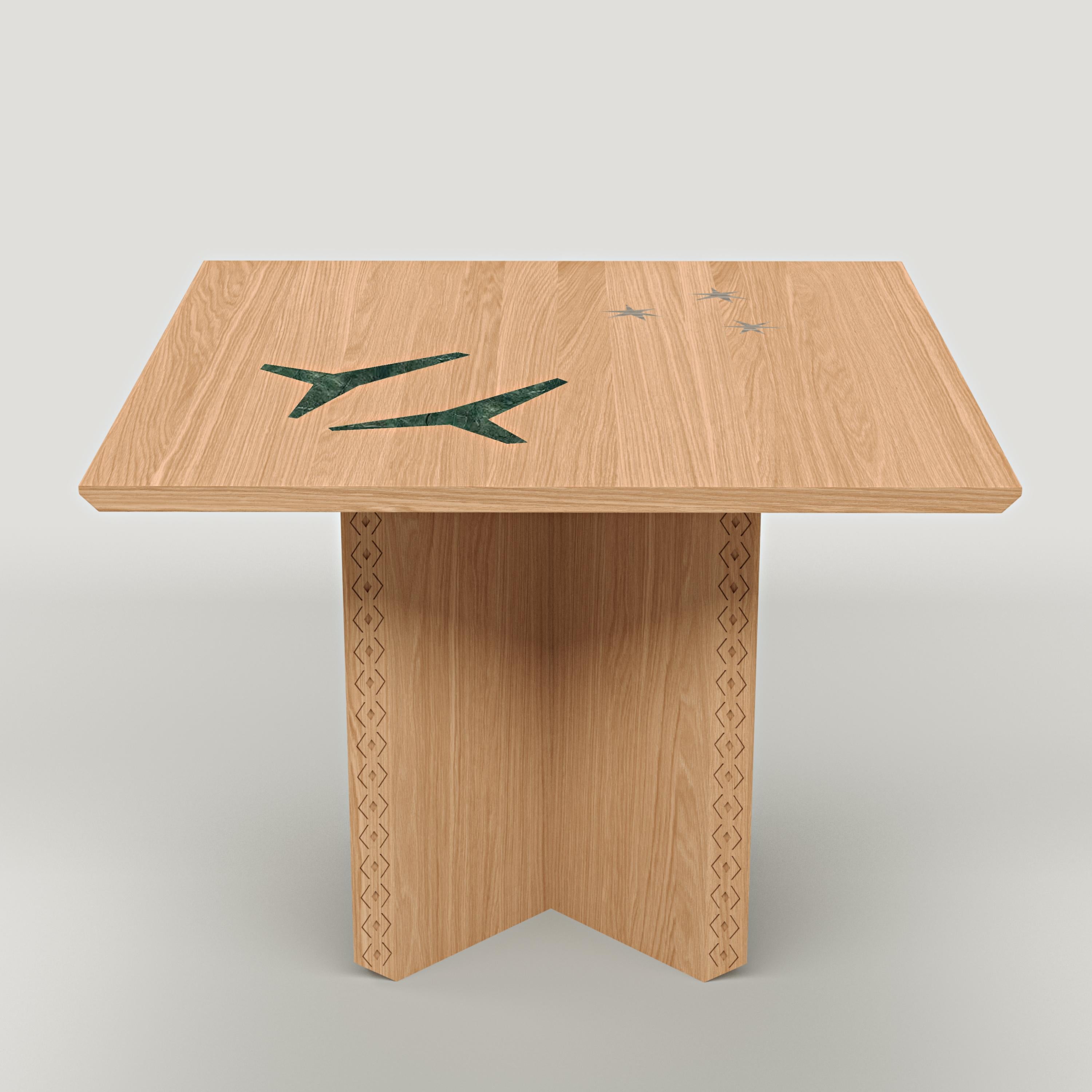 The Polaris Table is a versatile piece that serves as a modular dining table, console, or standalone art piece, seamlessly blending functionality with artistic expression. This version introduces the use of oak and green marble, offering a fresh