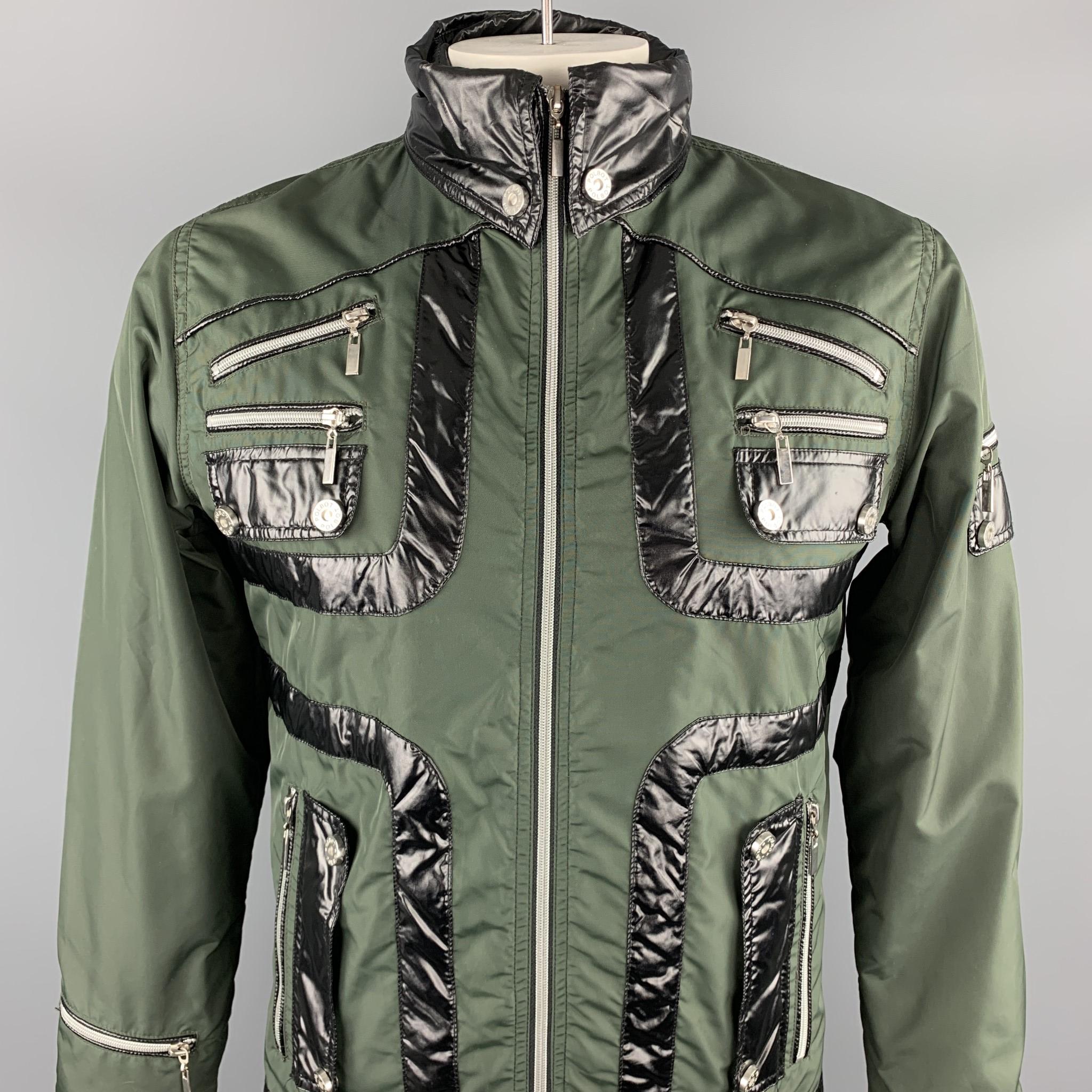 POLBOT jacket comes in a olive nylon with black trim details featuring zipper pockets throughout, buttoned collar, and a full zip & snap closure. Made in Italy. 

Excellent Pre-Owned Condition.
Marked: L

Measurements:

Shoulder: 17.5 in. 
Chest: 44