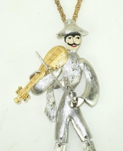 POLCINI Collar articulado de oro y plata con colgante de músico violinista, años 60