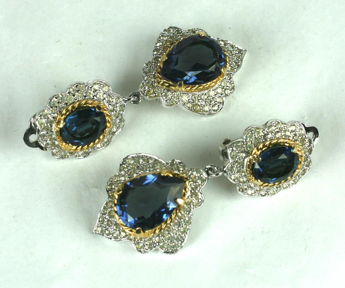 Polcini Faux Diamond and Sapphire Drop Earrings from the 1980's. Polcini specialized in making high quality faux jewels which replicated fine jewelry. Elaborate Pave stations with large faux sapphires are edged in gold wire work. Clip back