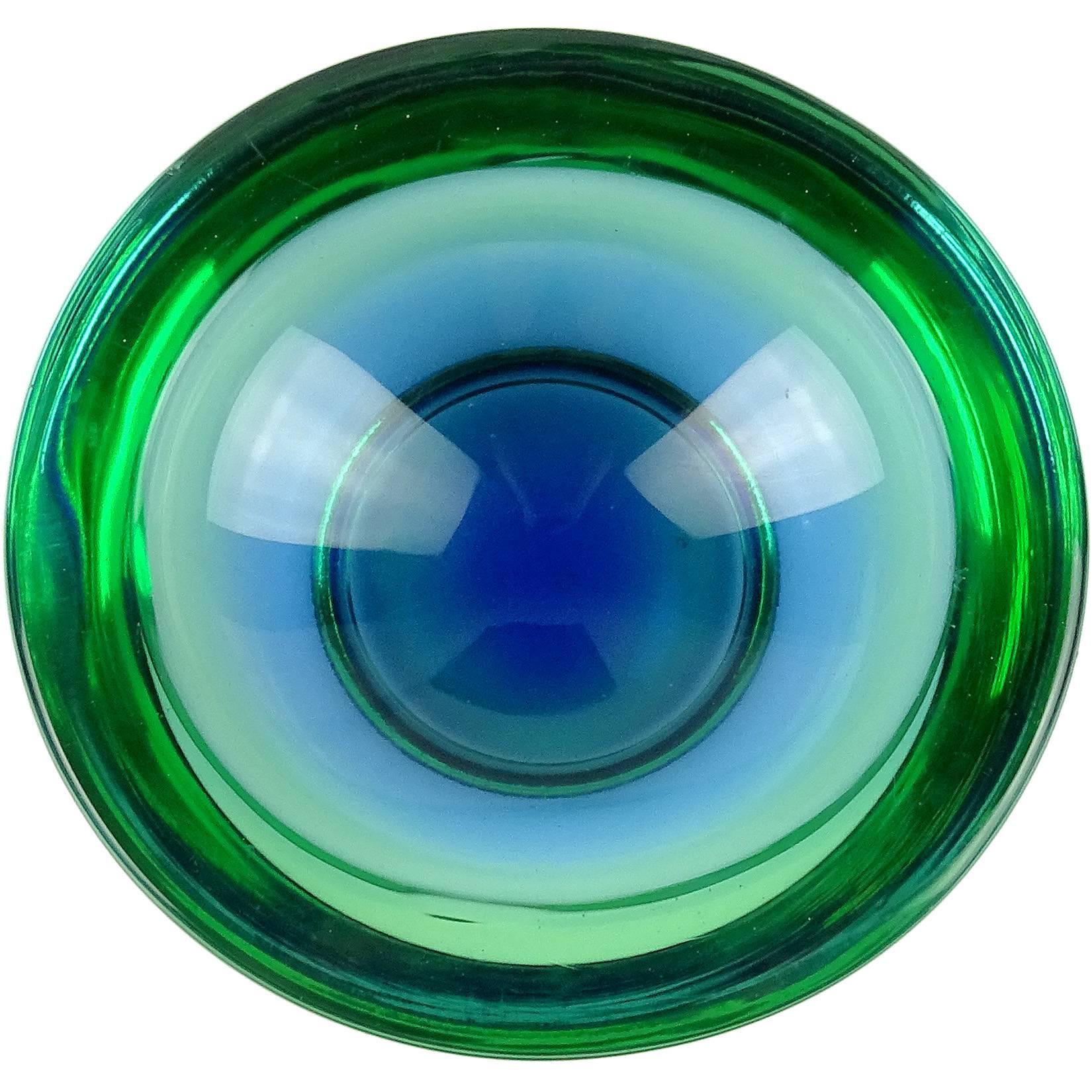 Beautiful Murano handblown Sommerso blue and green Italian art glass bowl. Documented to designer Flavio Poli, for the Seguso Vetri d'Arte company. The piece is very thick and heavy, raised by a sculpted foot, and flat cut rim. Measures: 6 1/2’ x 6