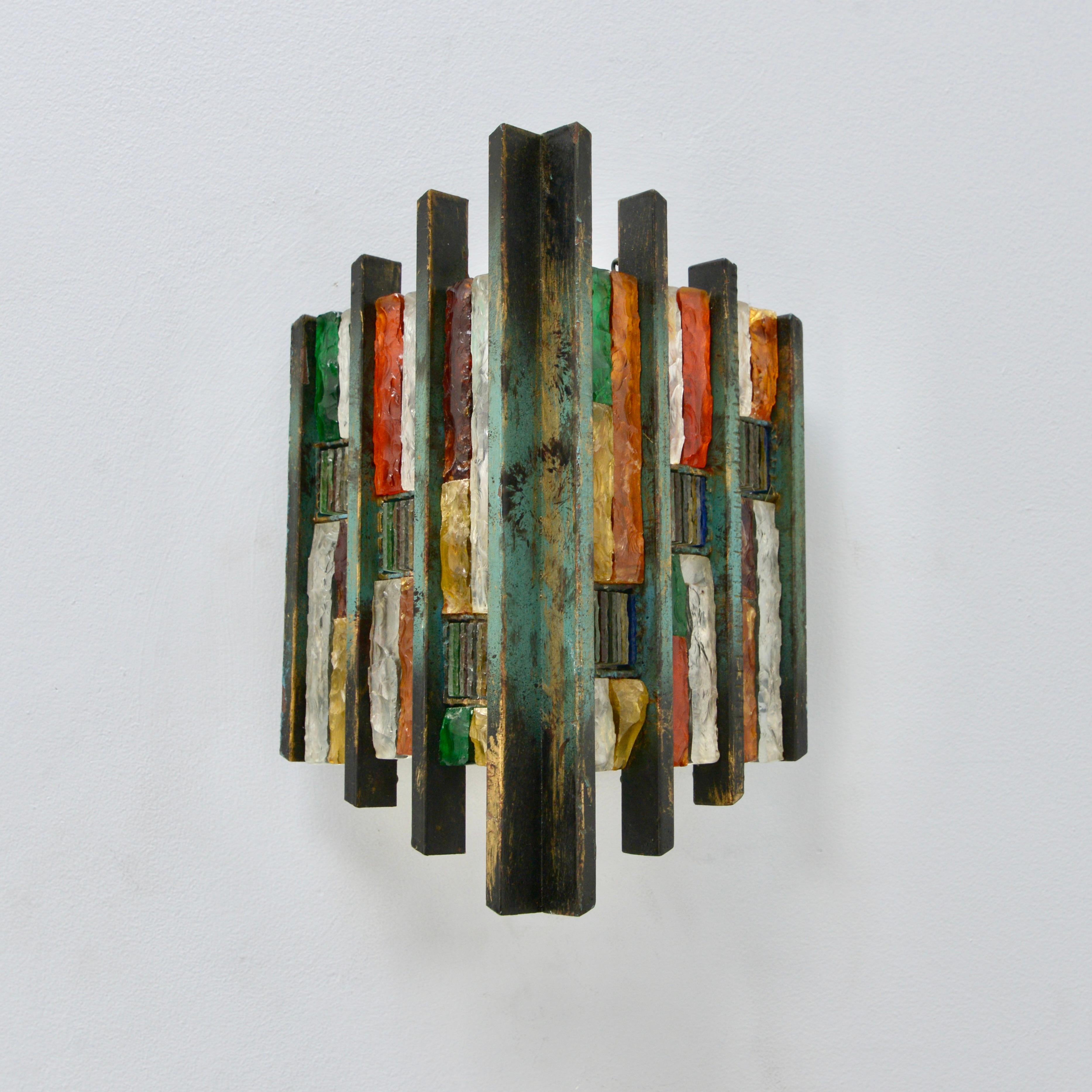 Pair of fantastic Brutalist glass Poliarte sconces from Italy of the 1970s. In multicolored glass and steel in original finish. Wired with a single E-26 medium based socket per sconce. These fixtures can be wired for any worldwide location. Light