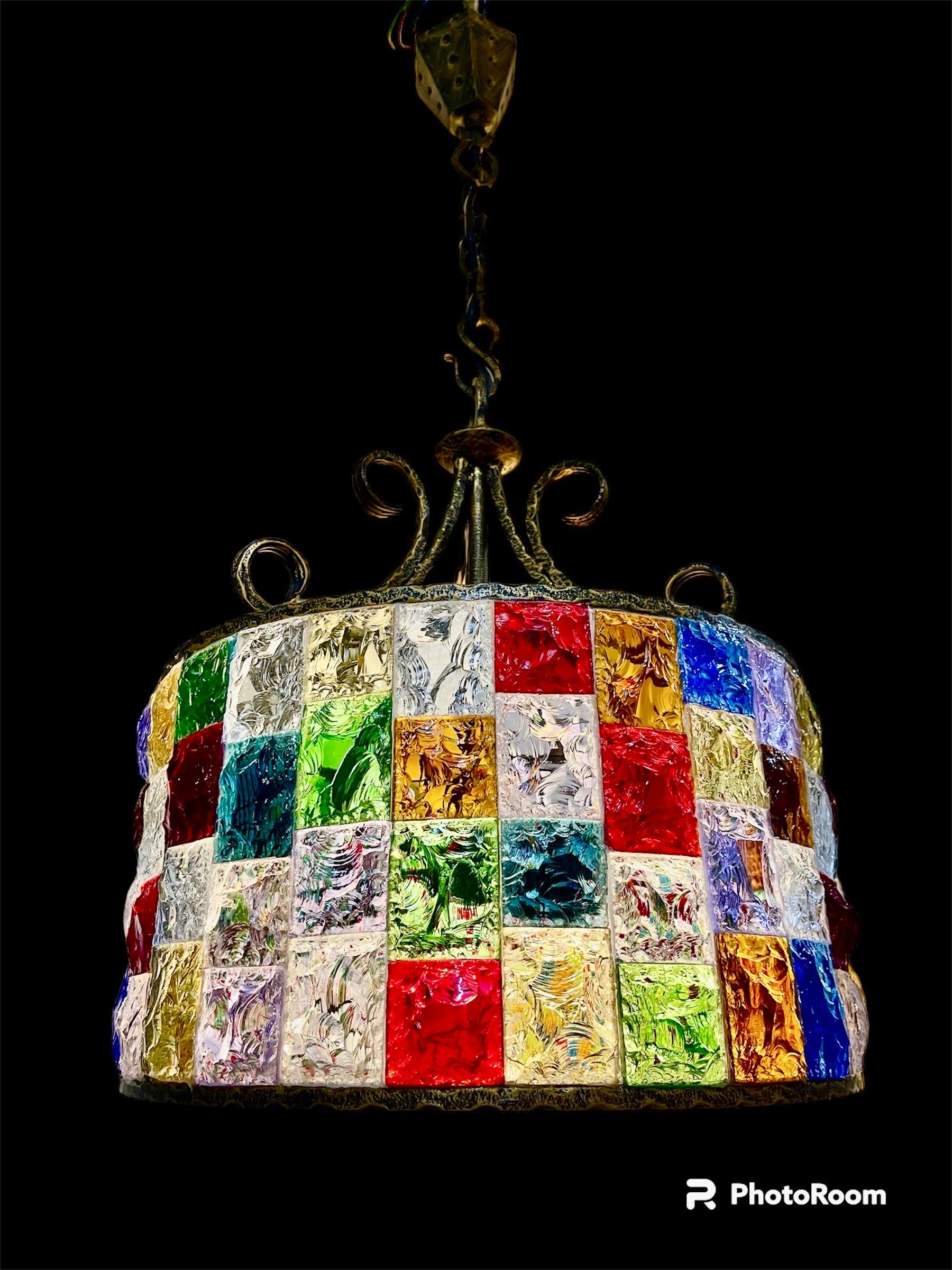 Superbe Chandelier multicolore glass Murano with brutalisat iron structure . The Design and the quality of the glass make this piece the best of the italian Design .
This unique Chandelier in multicolore glass murano are exceptional .

This Pieces