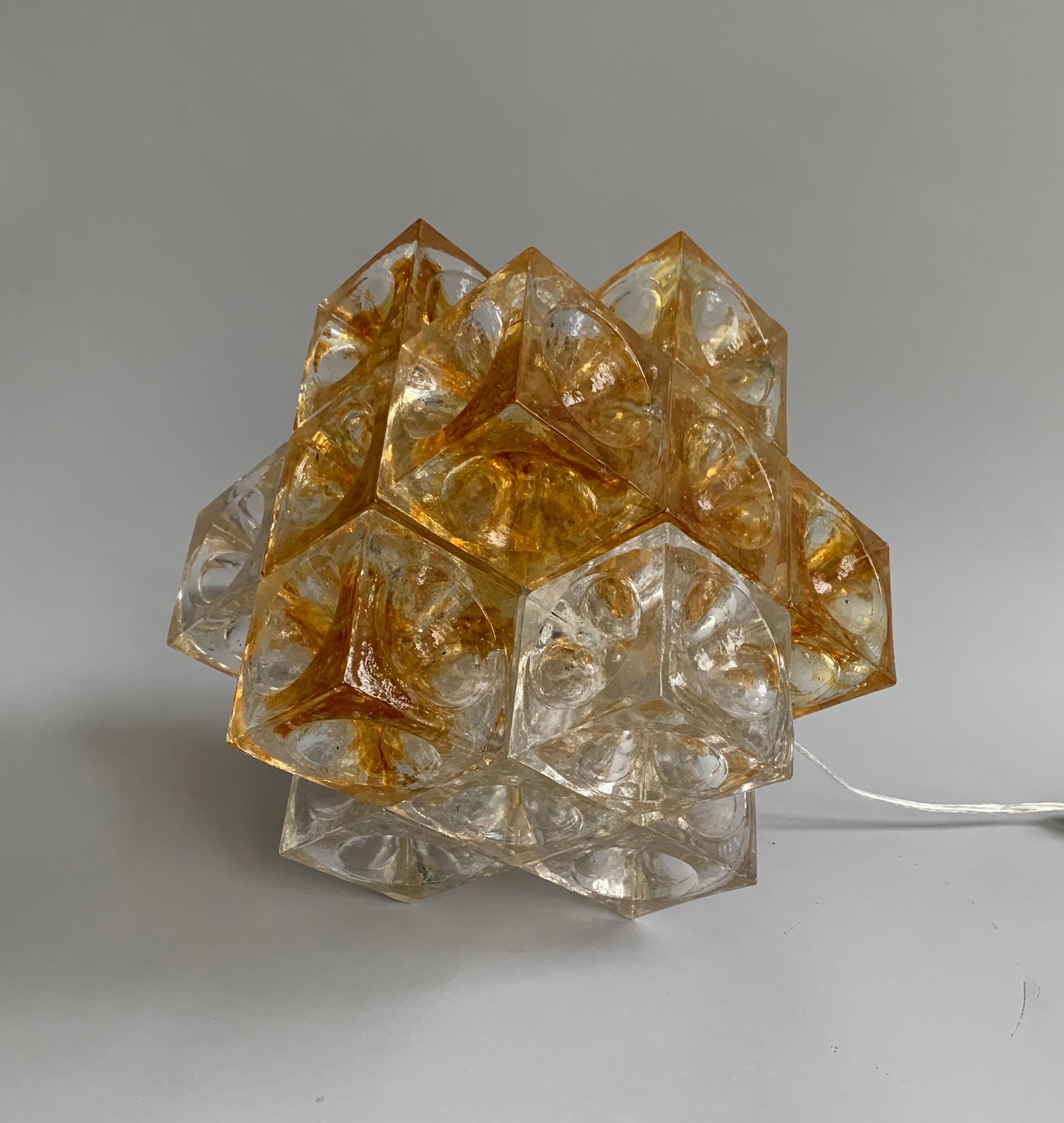 Eighteen cast glass cubes with a hemispheric grove. Internal lightbulb (75watts). Rewired with original on/off switch. This lamp is documented in an original Poliarte catalog.