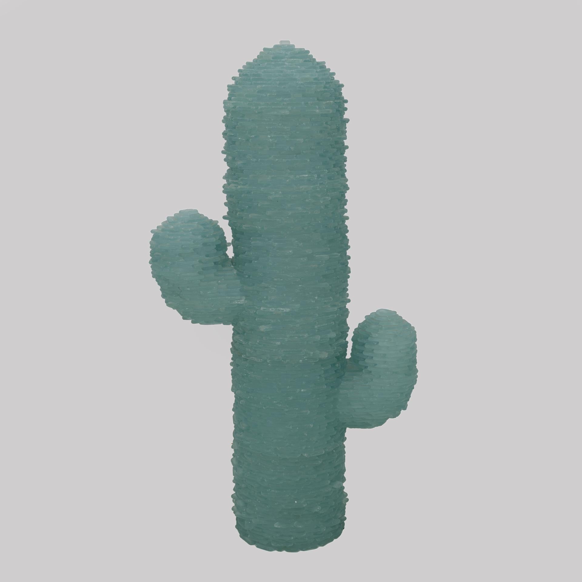 Splendid luminous sculpture entirely made of precious Murano glass sheets of a splendid aquamarine colour, attributed to Poliarte. More than a floor lamp, it is a cactus sculpture made up of small pieces of sea green Murano glass. It is made up of a