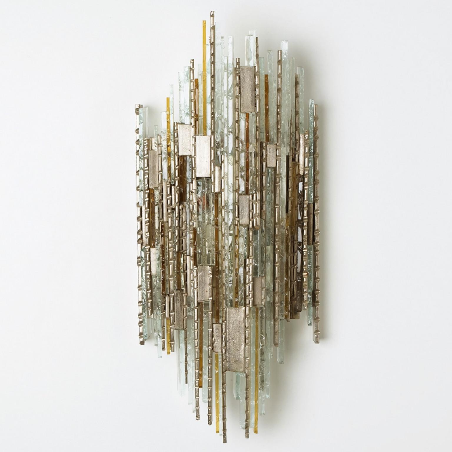 Frosted stained wall lights. Manufactured by PoliArte, Italy in the 1970s. Albano Poli founded Poliarte in 1968 as an innovative and experimental lighting company.

His typical style was combining stainless steel or raw metal to modular compositions