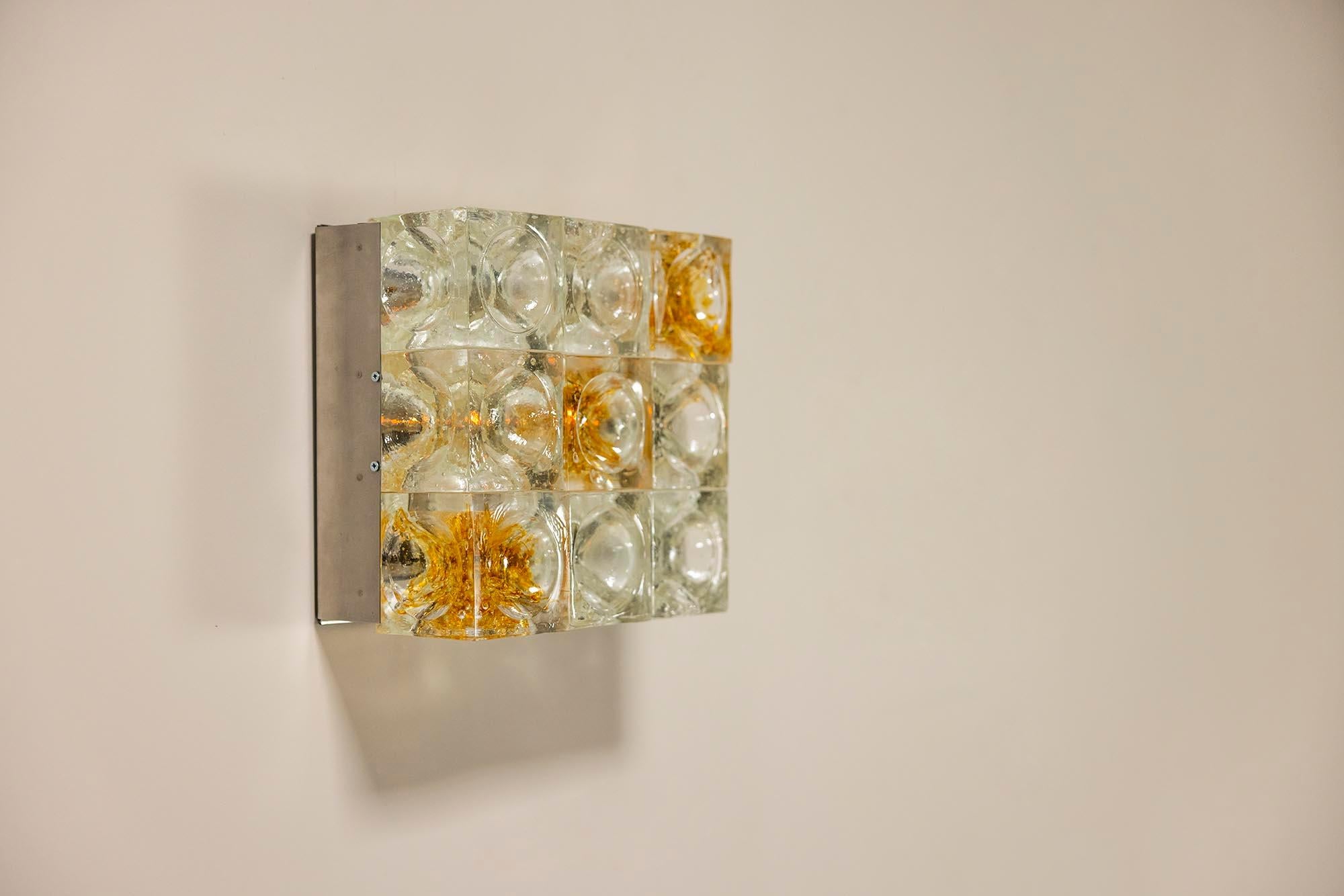 Albano Poli is a glass artist from Verona who specializes mainly in stained glass techniques. In 1953 he opened a small studio and in the early 1970s he started the PoliArte label, which was entirely focused on making lamps.

Design
This wall sconce
