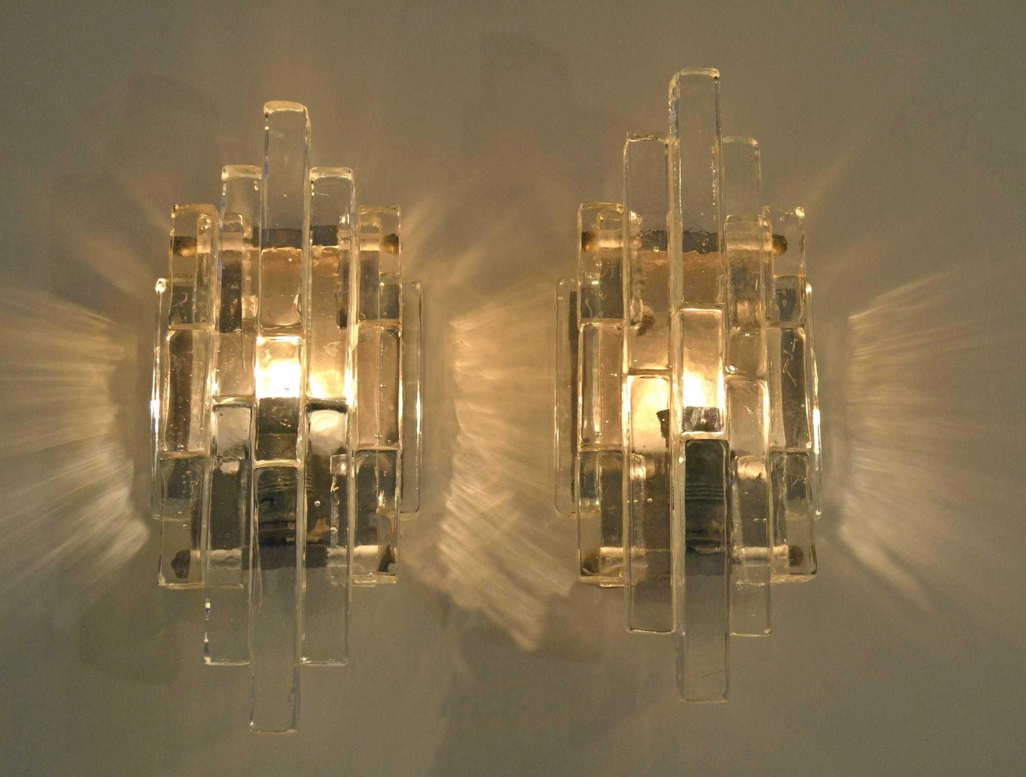 A pair of original wall sconces by Albano Poli for Poliarte in the iconic 