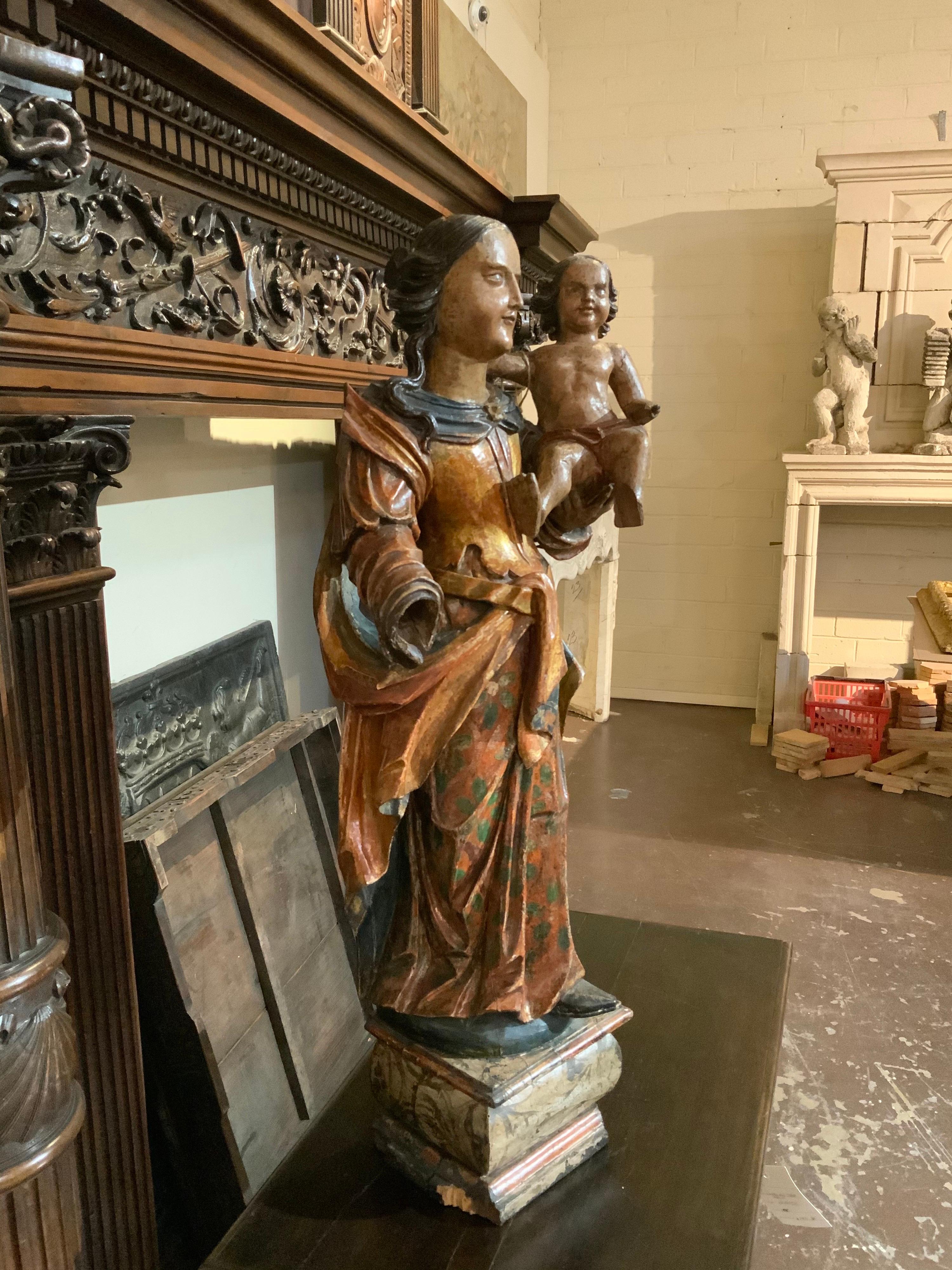 This Polichrom Madona and Child statue origins from Italy, circa 1800.